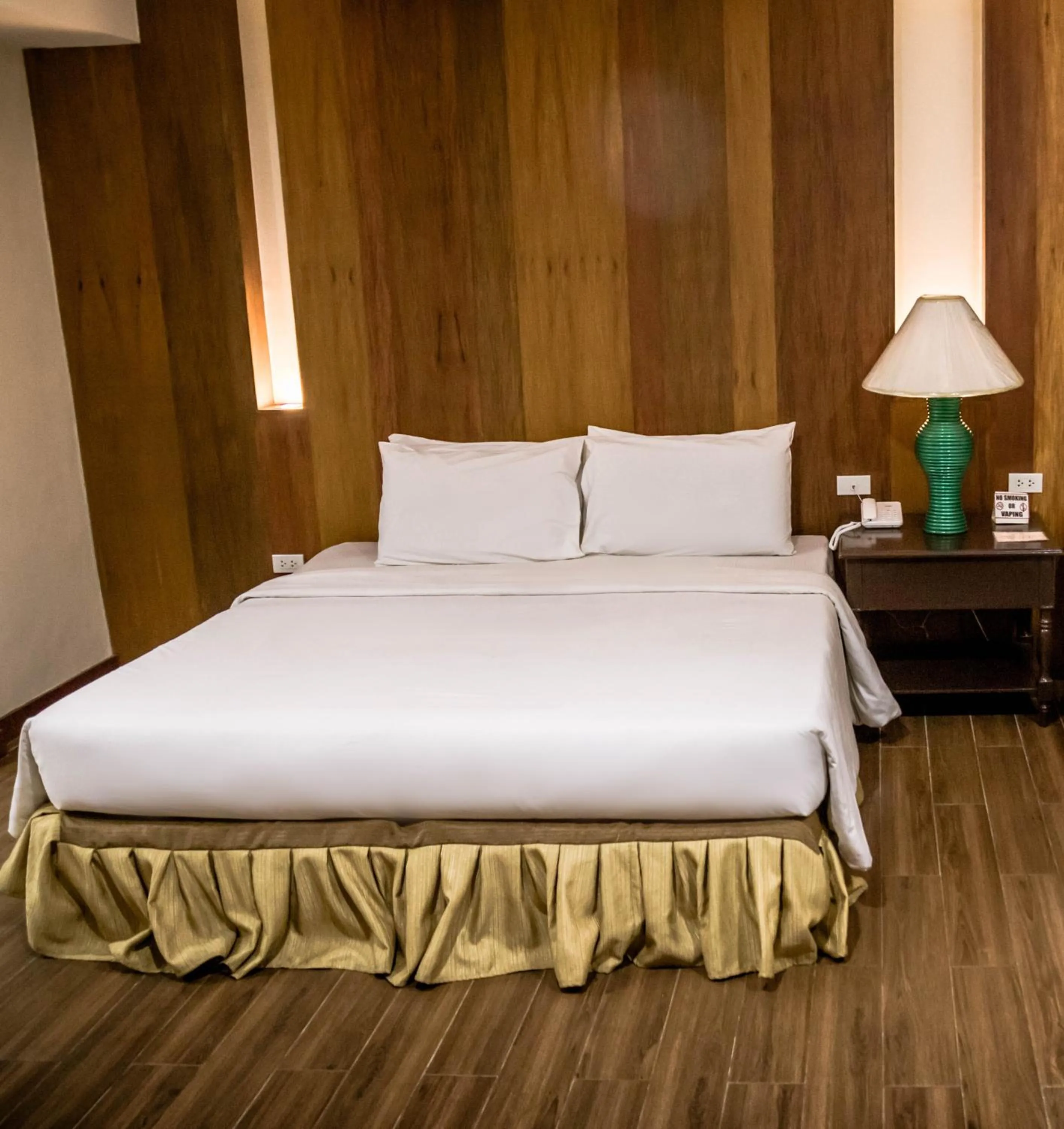 Bed in La Fiesta Hotel