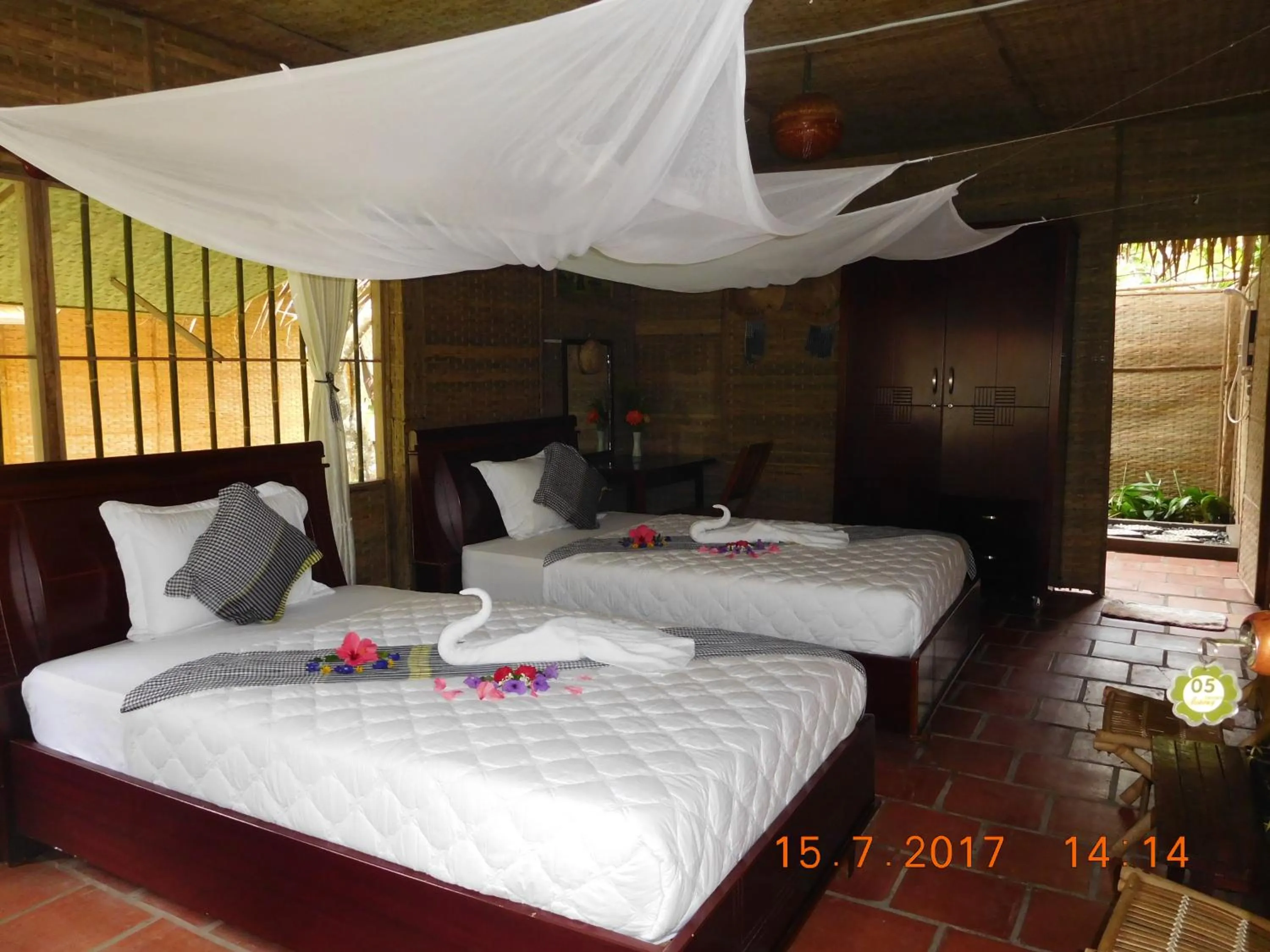 Bed in Mekong Ecolodge Bungalow