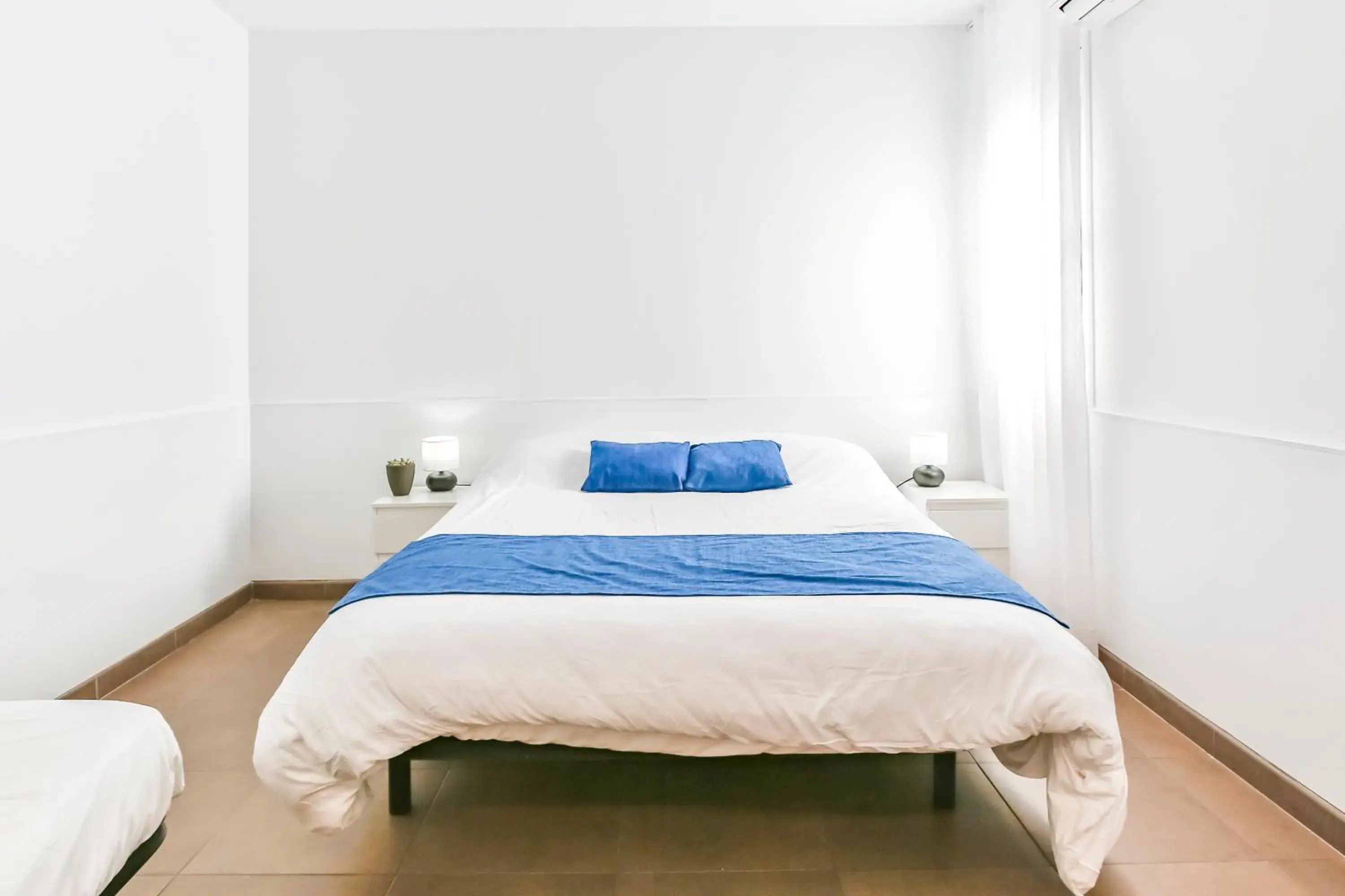 Bed in Laramond Barcelona Rooms Bed in Laramond Barcelona Rooms