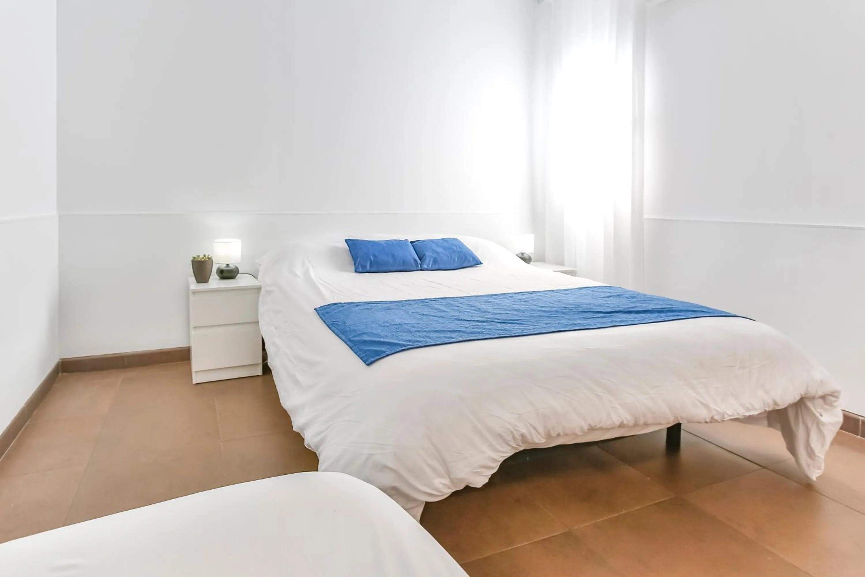 Bed in Laramond Barcelona Rooms