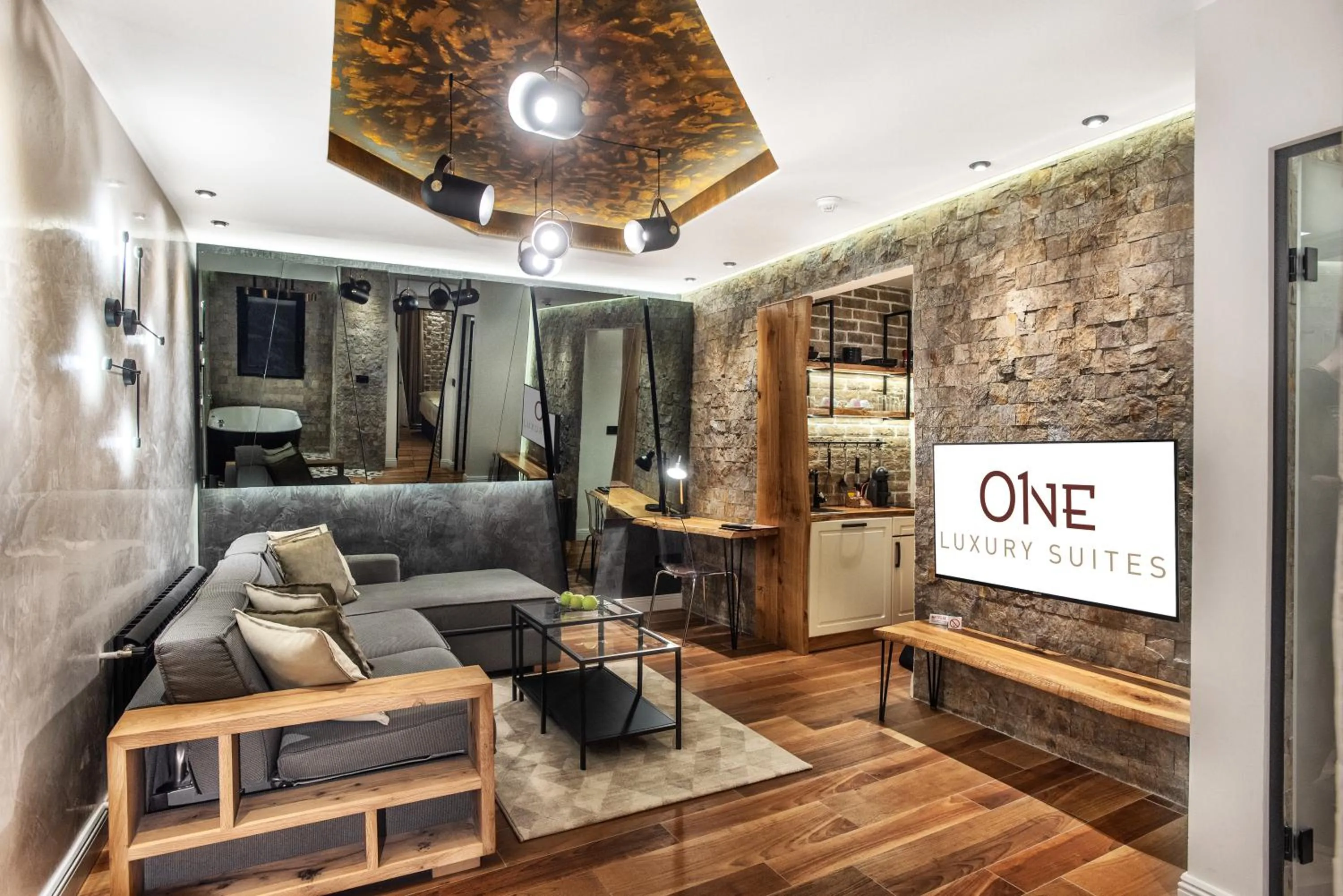 Communal lounge/ TV room in One Luxury Suites