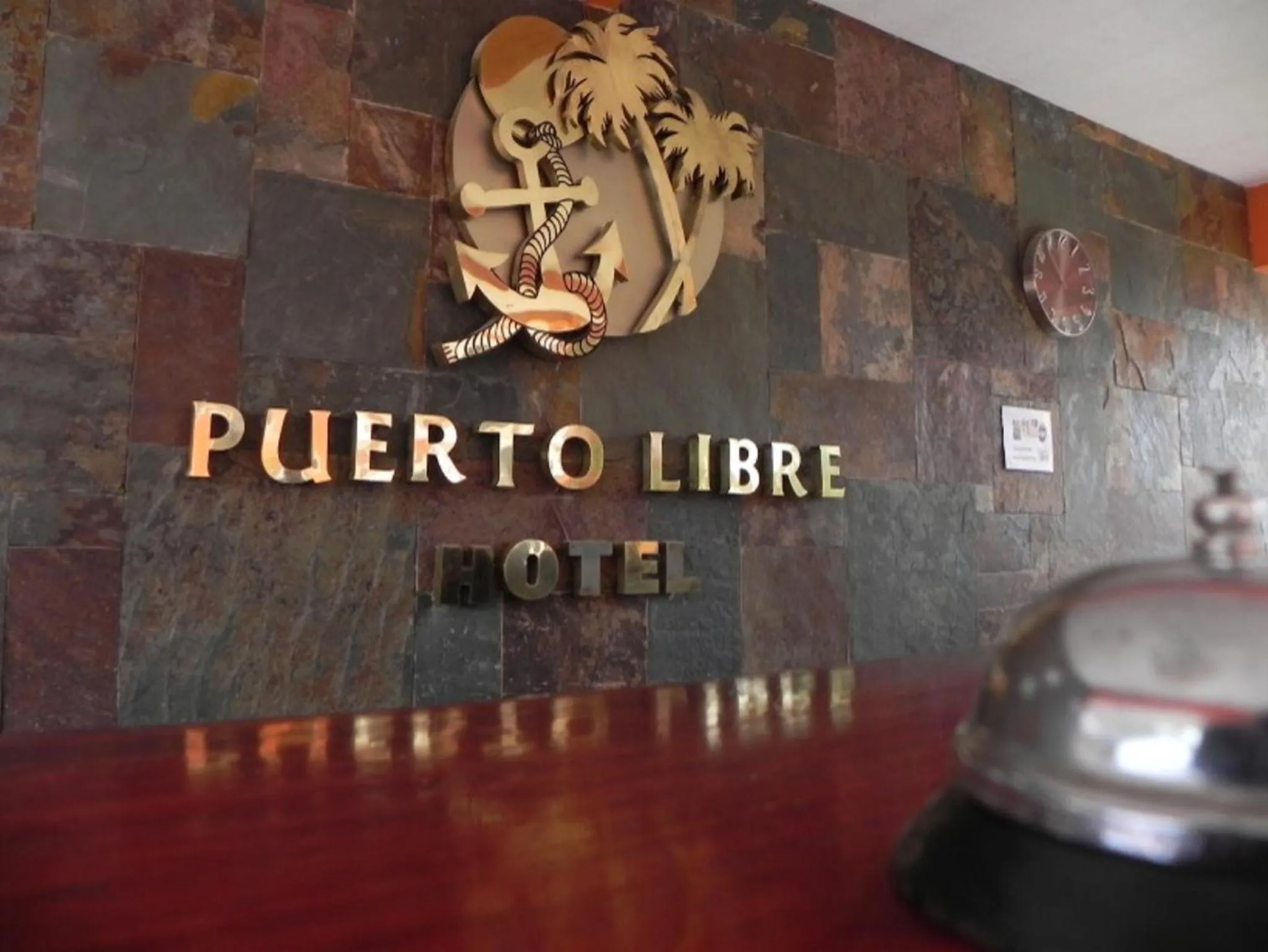 Property logo or sign in Hotel Puerto Libre