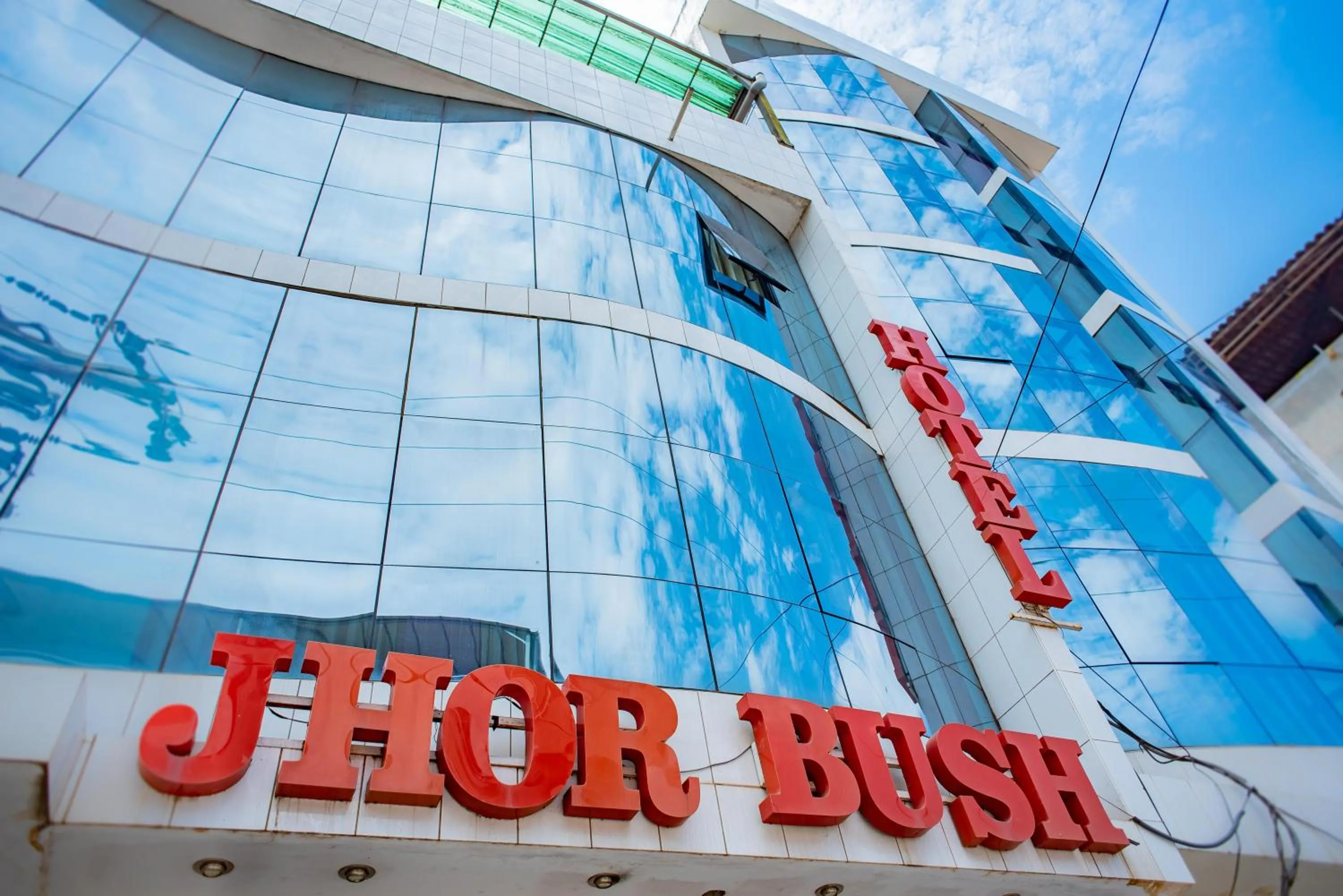 Property logo or sign in Hotel Jhor Bush