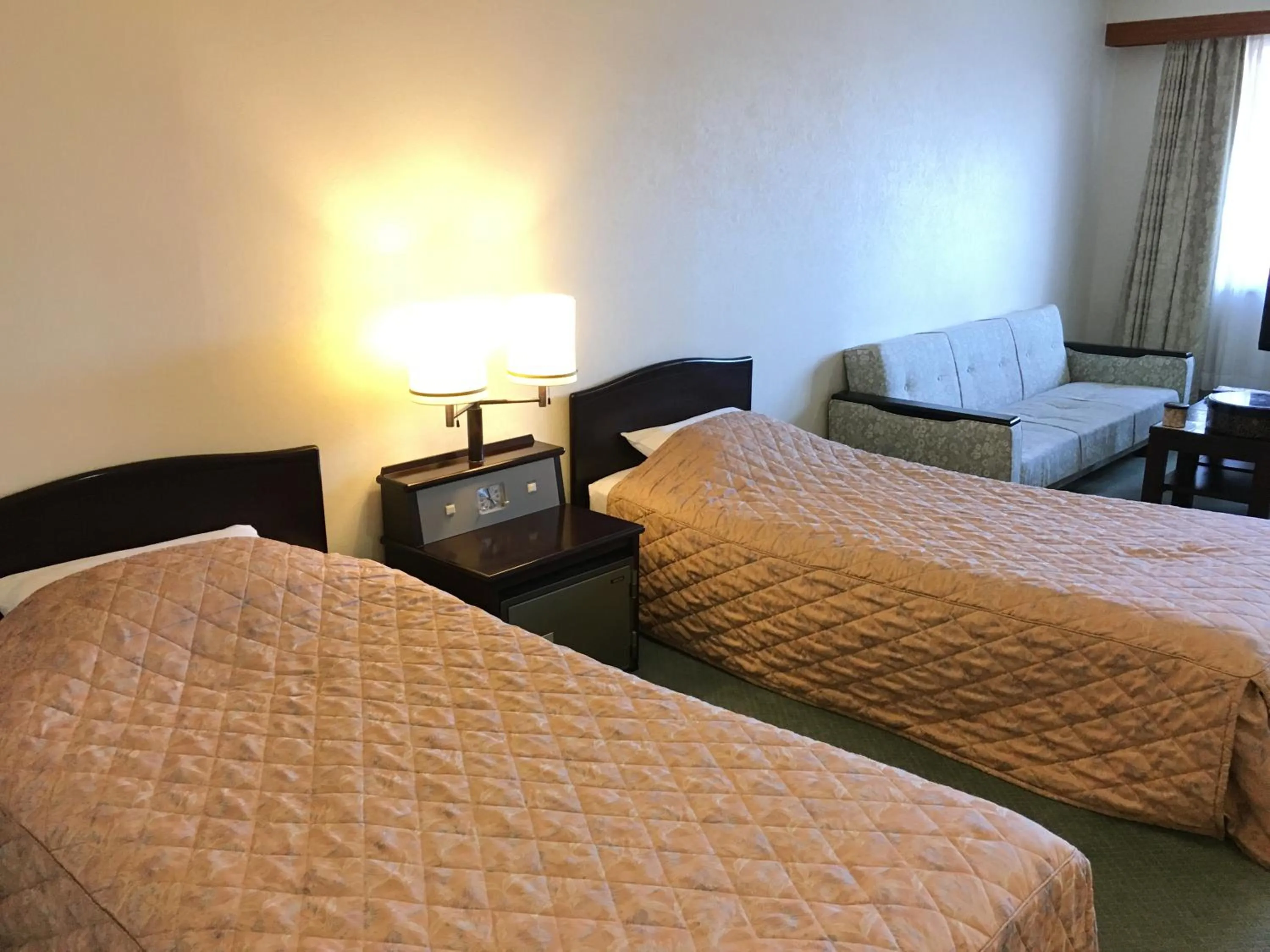 Bed in Nikko Astraea Hotel