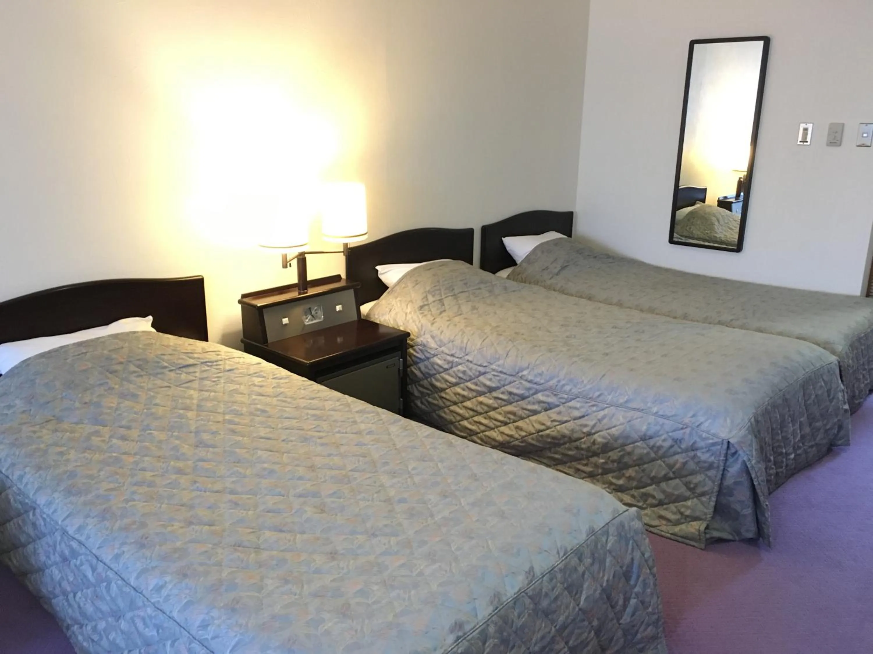 Bed in Nikko Astraea Hotel