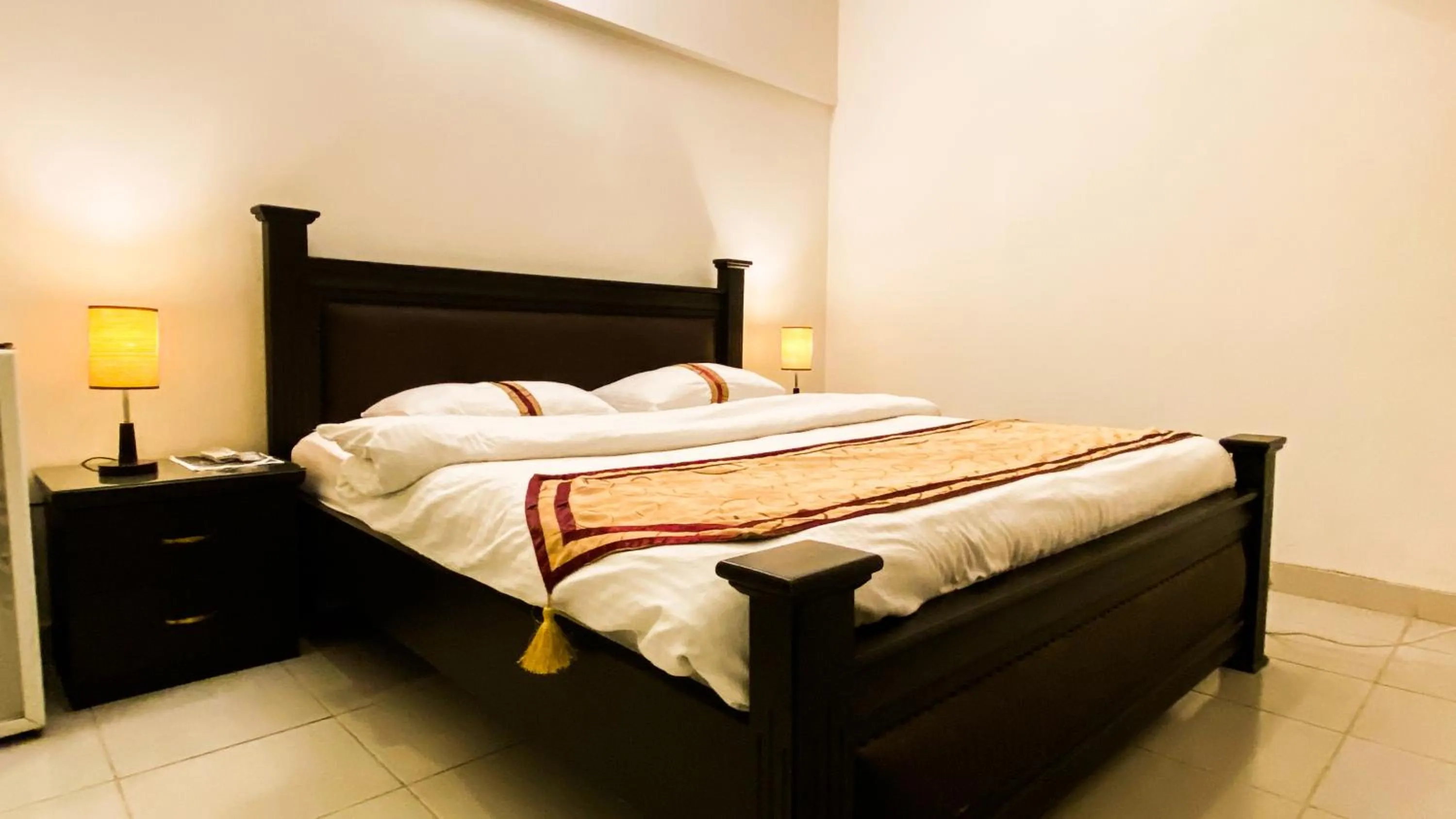 Bed in Royal Inn Hotel