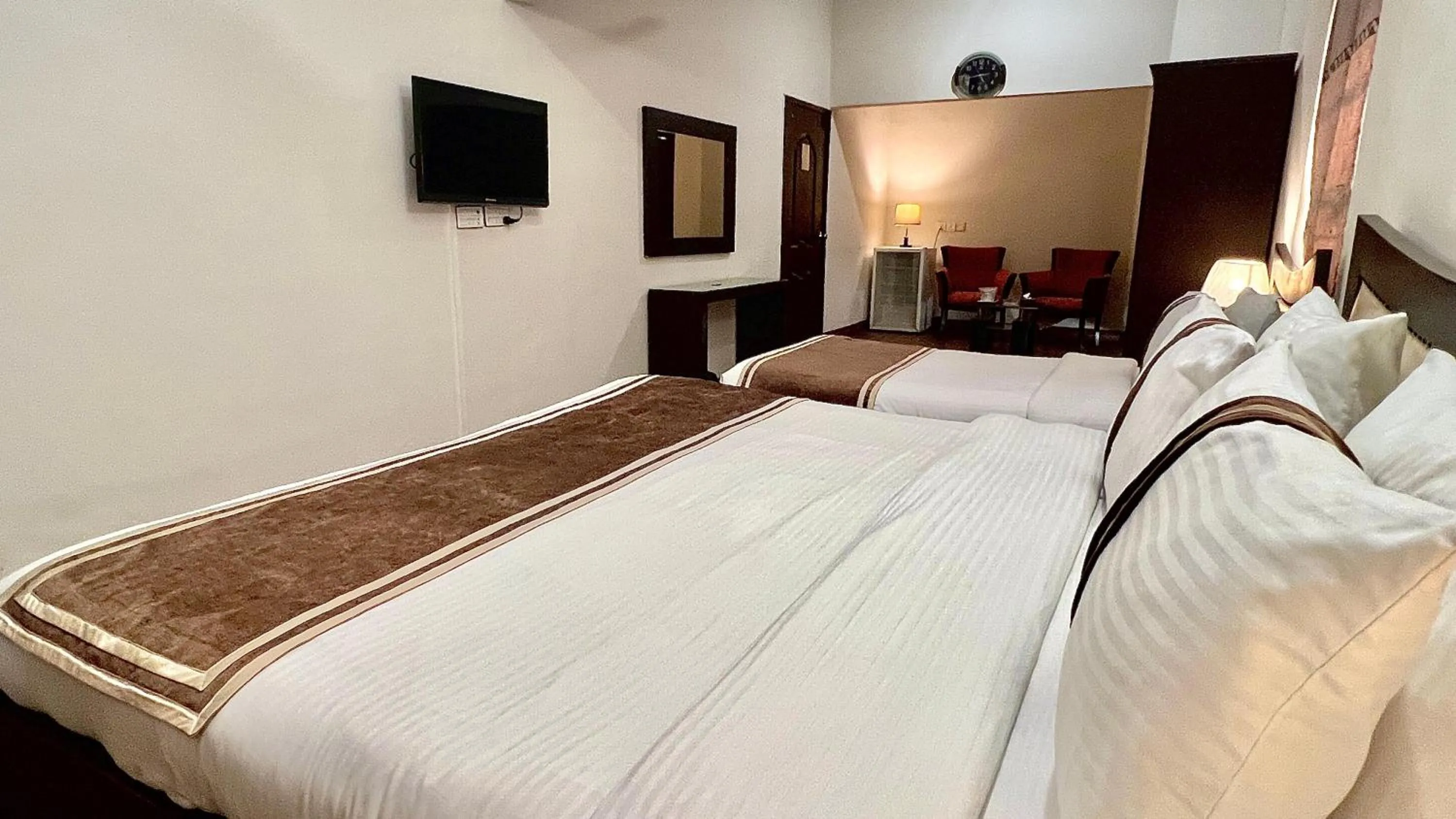 Bed in Royal Inn Hotel