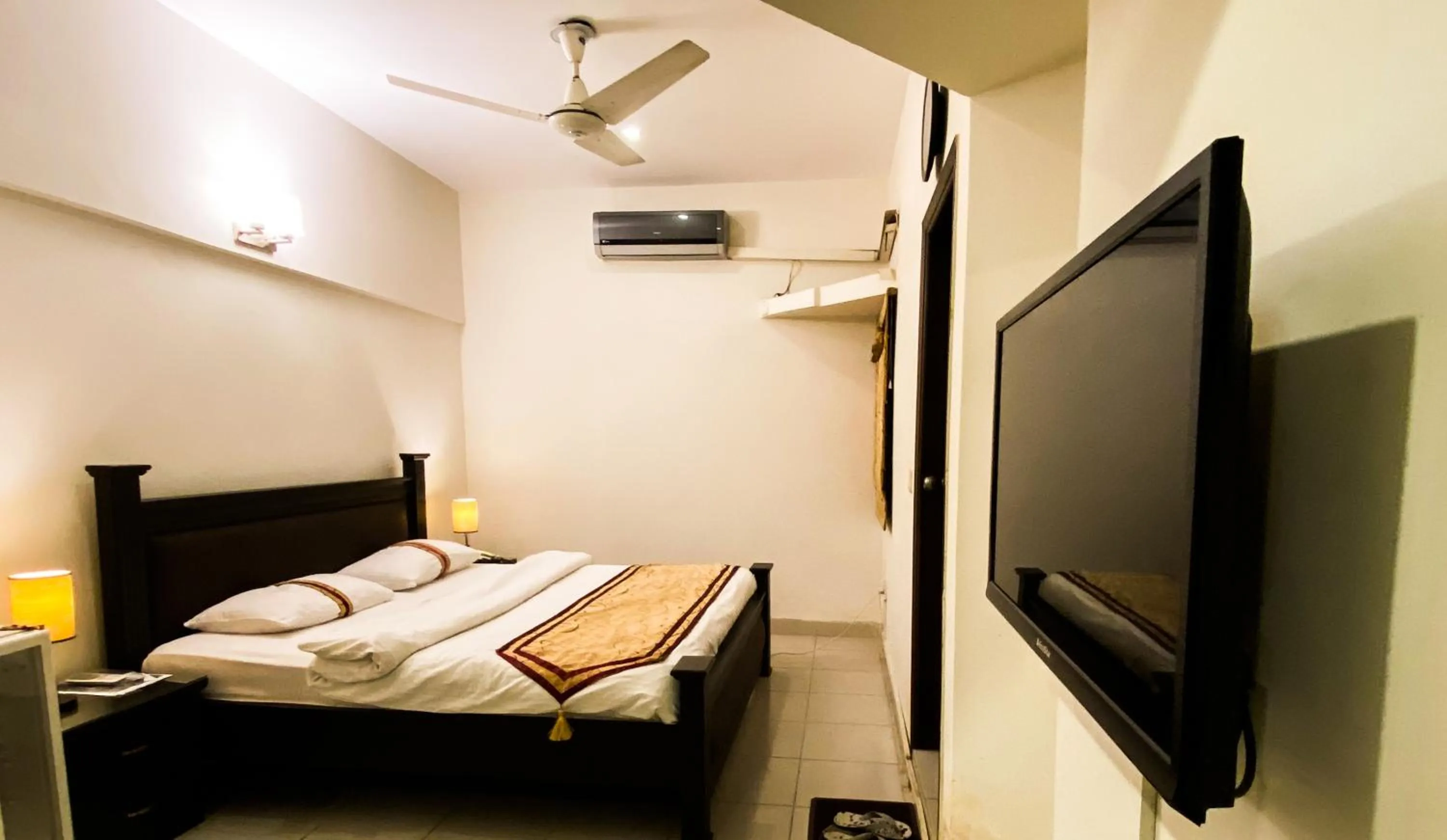 Bed in Royal Inn Hotel