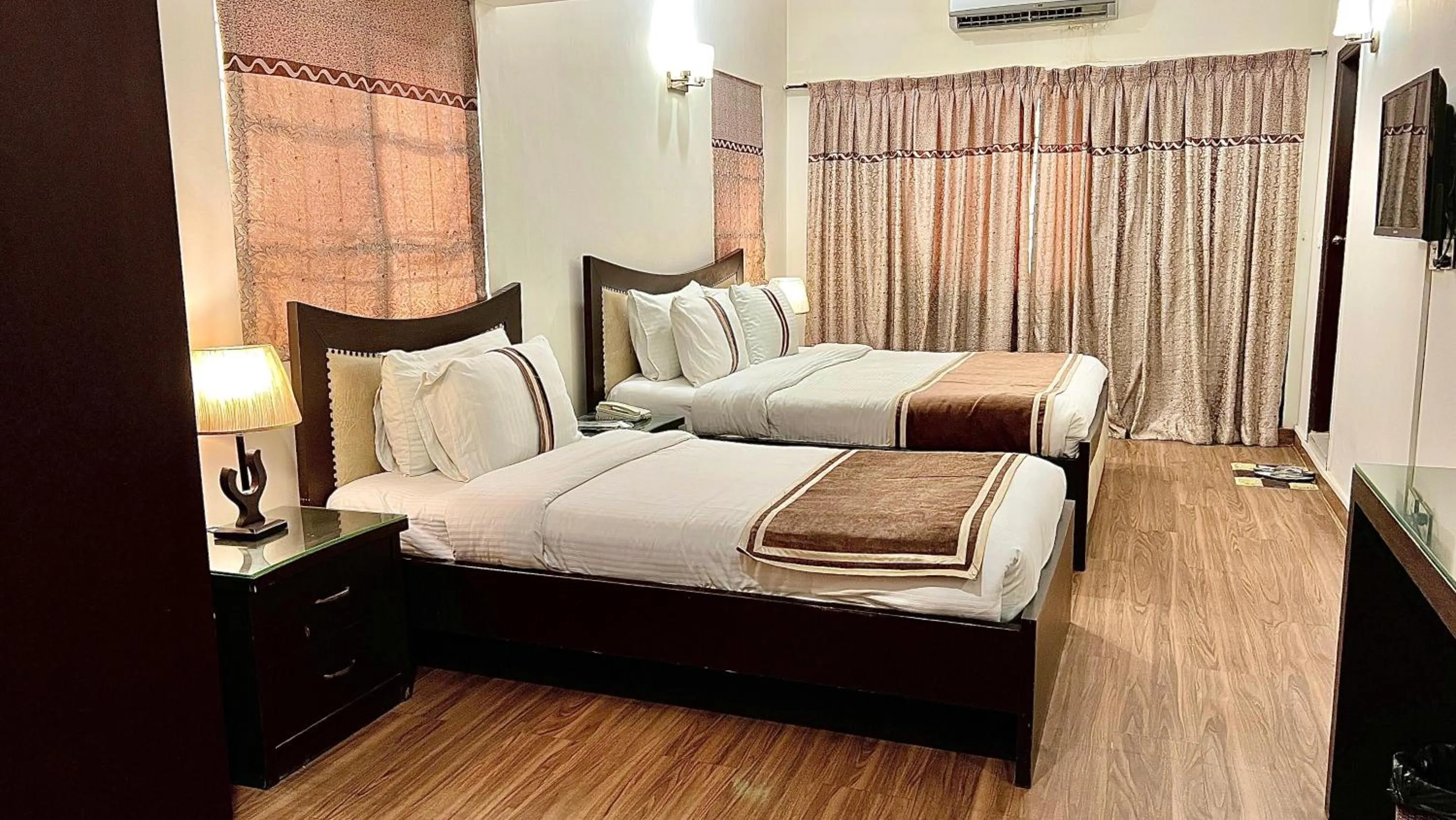 Bed in Royal Inn Hotel