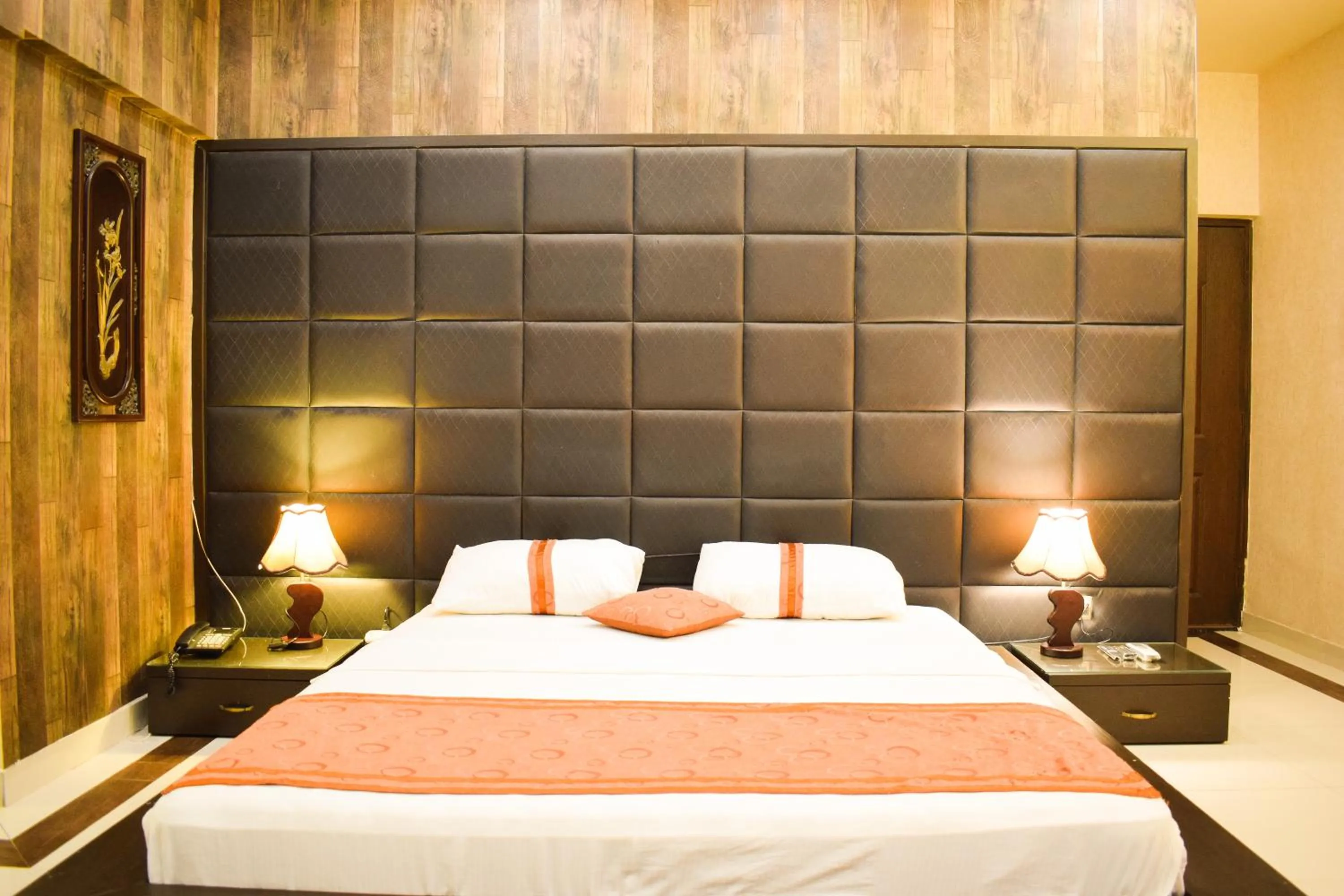 Bed in Royal Inn Hotel