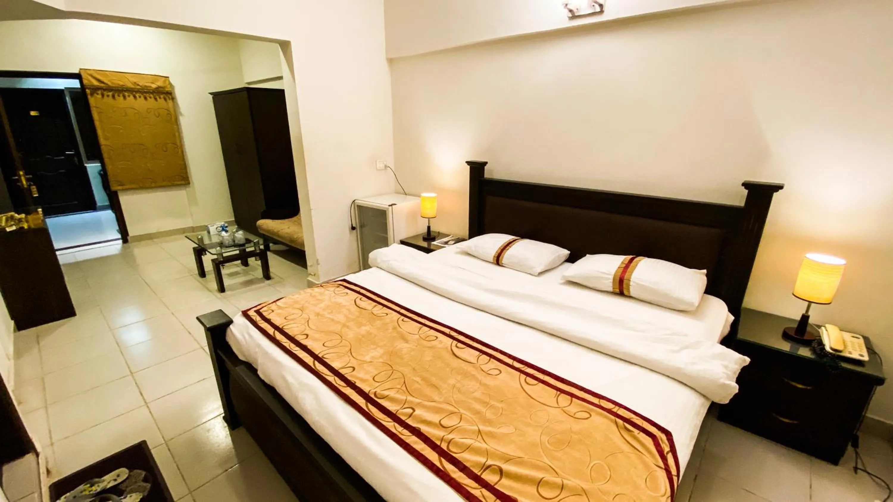 Bed in Royal Inn Hotel