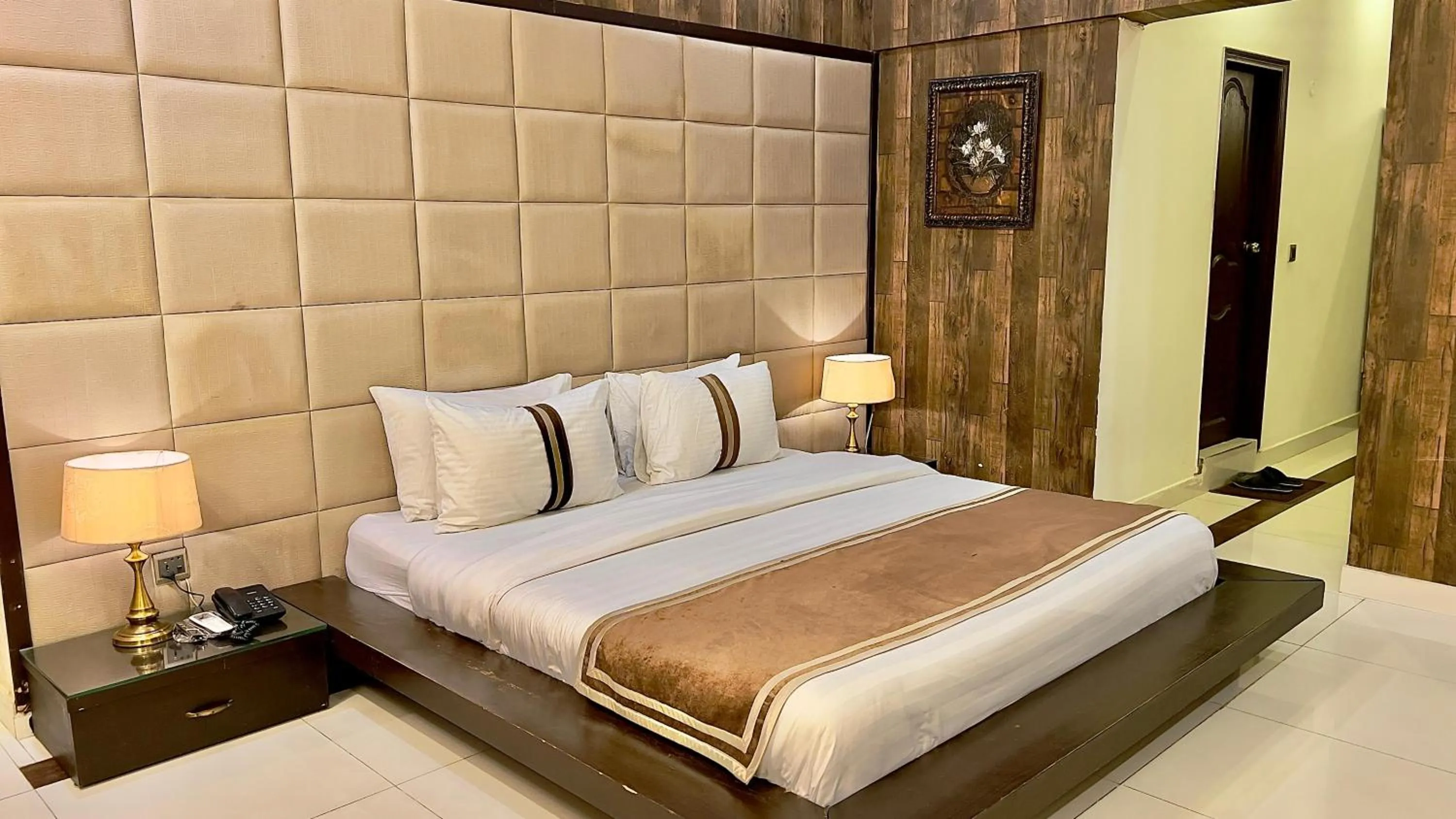 Bed in Royal Inn Hotel