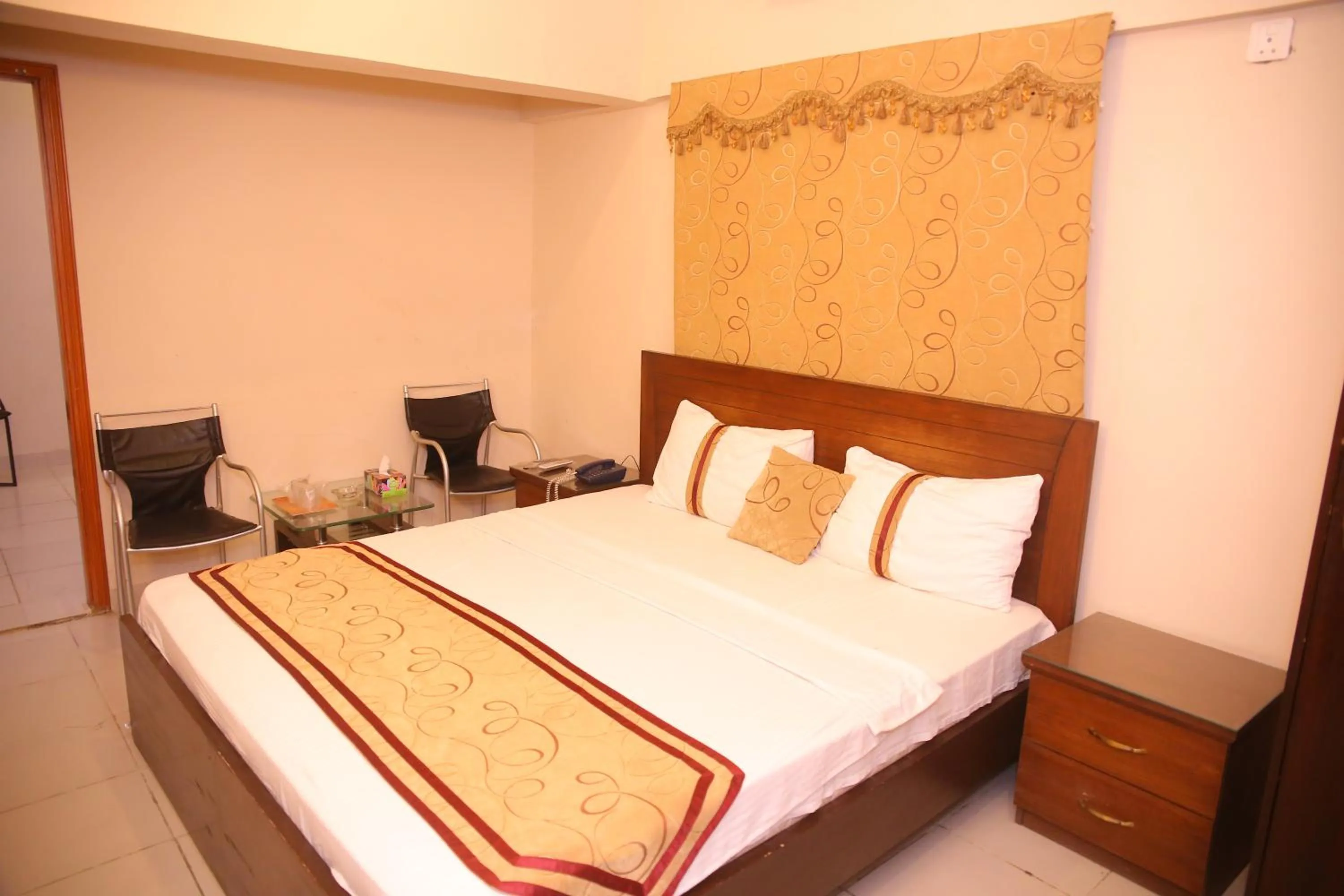 Bed in Royal Inn Hotel