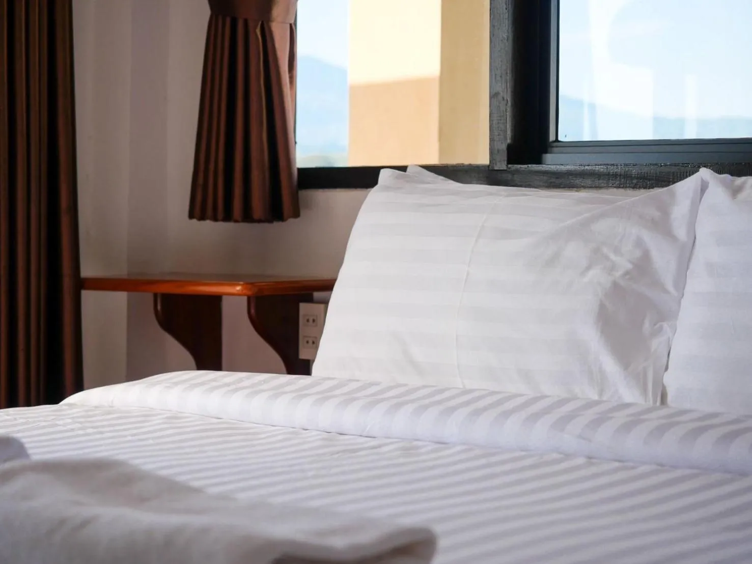 Bed in Riverside Houayxay Hotel