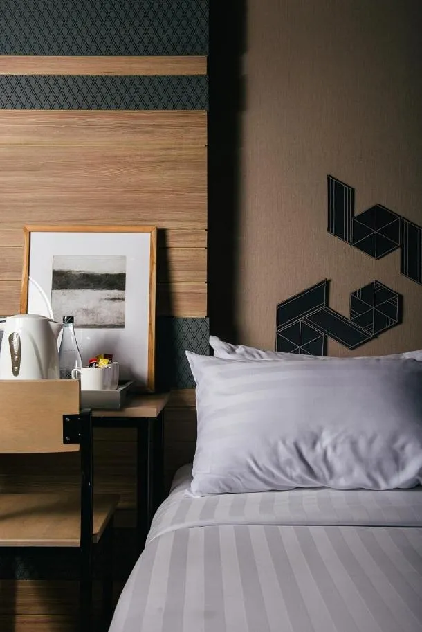 Bed in NAP Hotel Bangkok