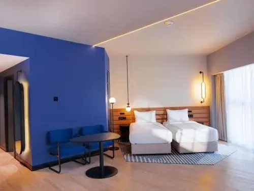 Superior Twin Room with Sofa in Novotel Madinah Superior Twin Room with Sofa in Novotel Madinah