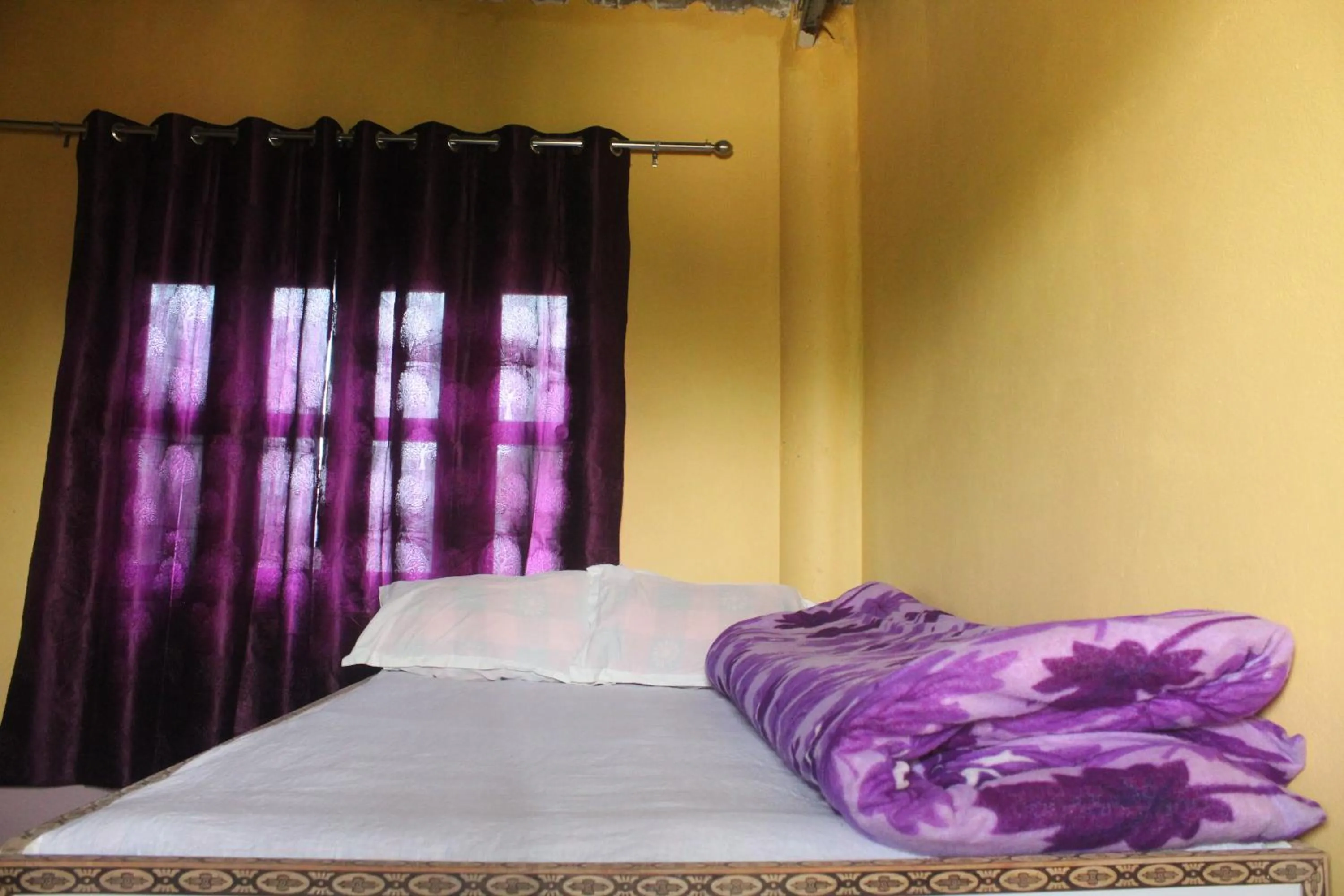 Bed in Shanta Ghar A Rustic Guesthouse