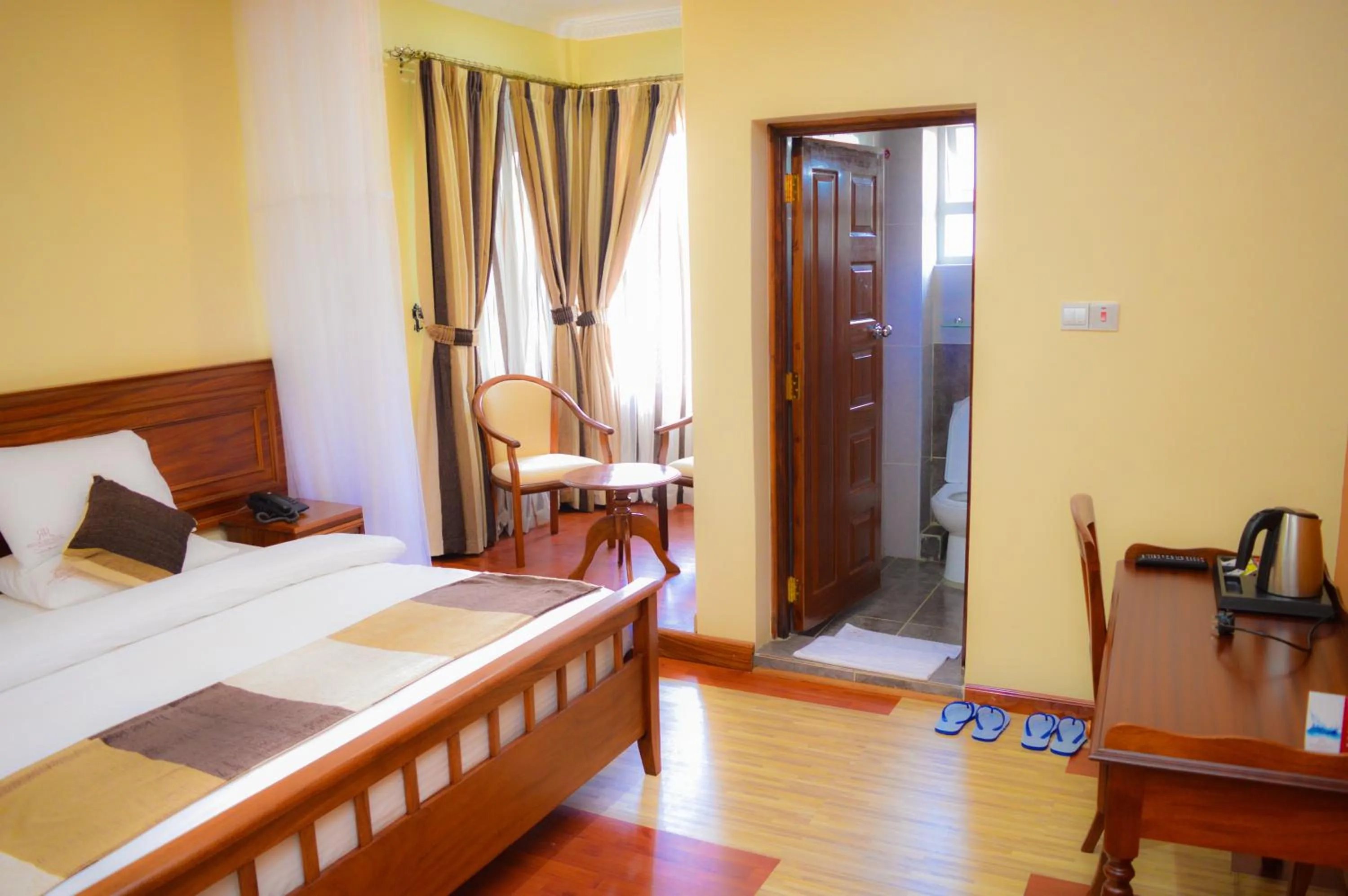 Photo of the whole room, Bed in Red Ruby Hotel