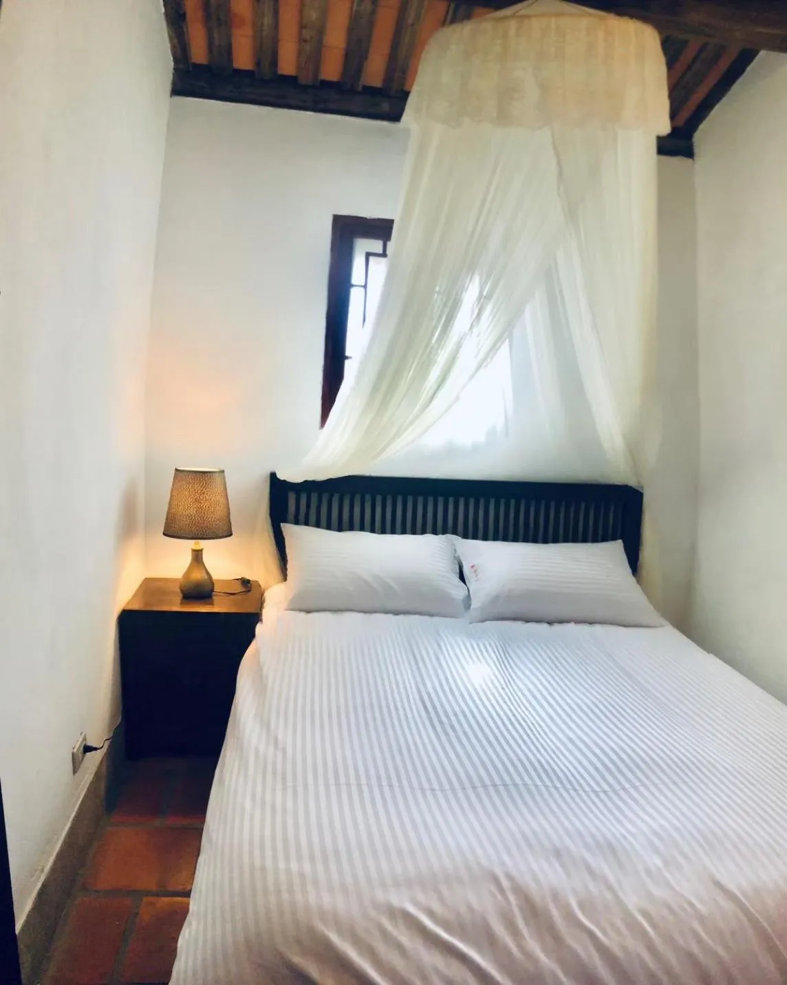 Bed in Red Tomato B&B