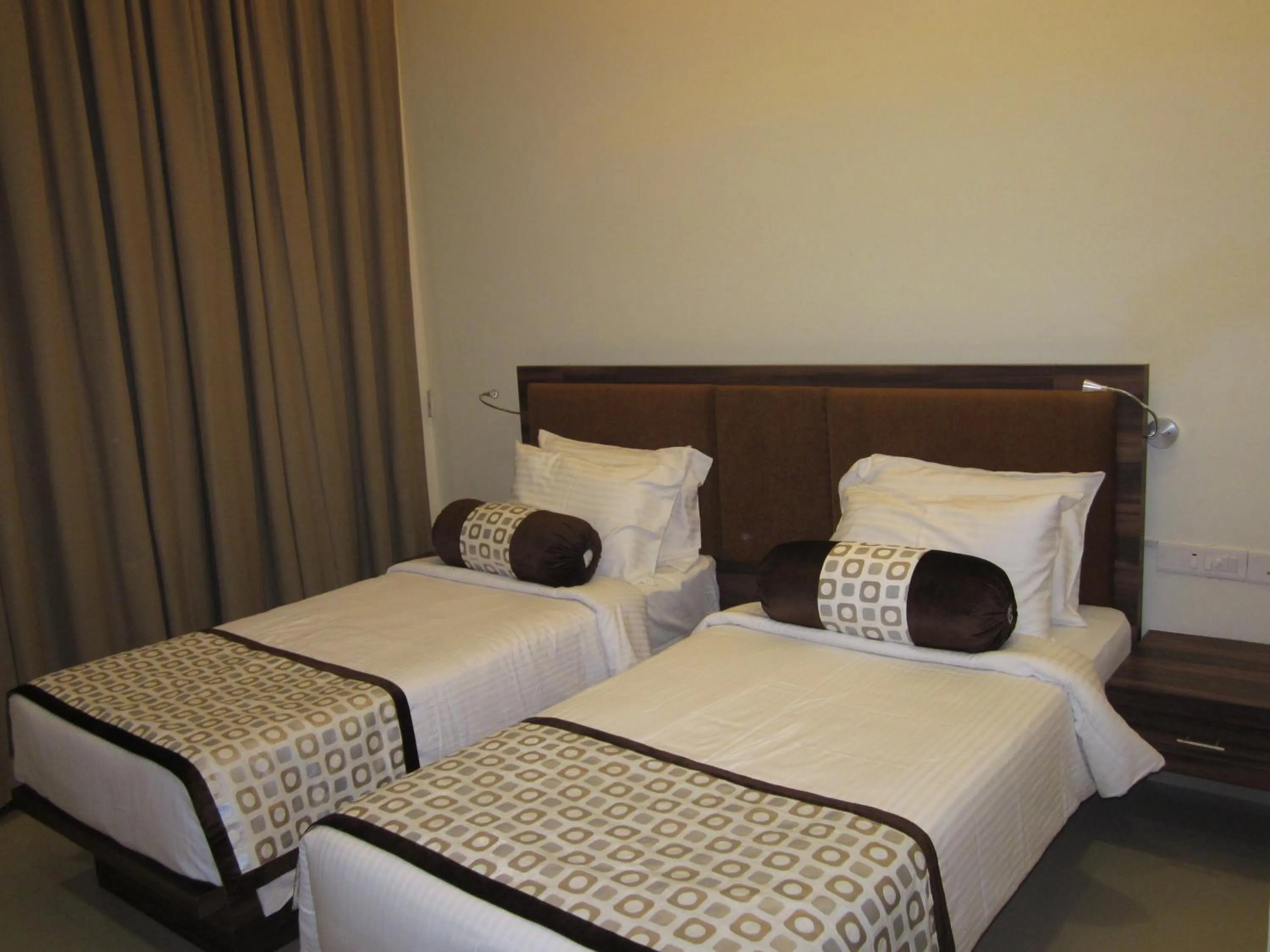 Bed in Vijaya Tej Clarks Inn