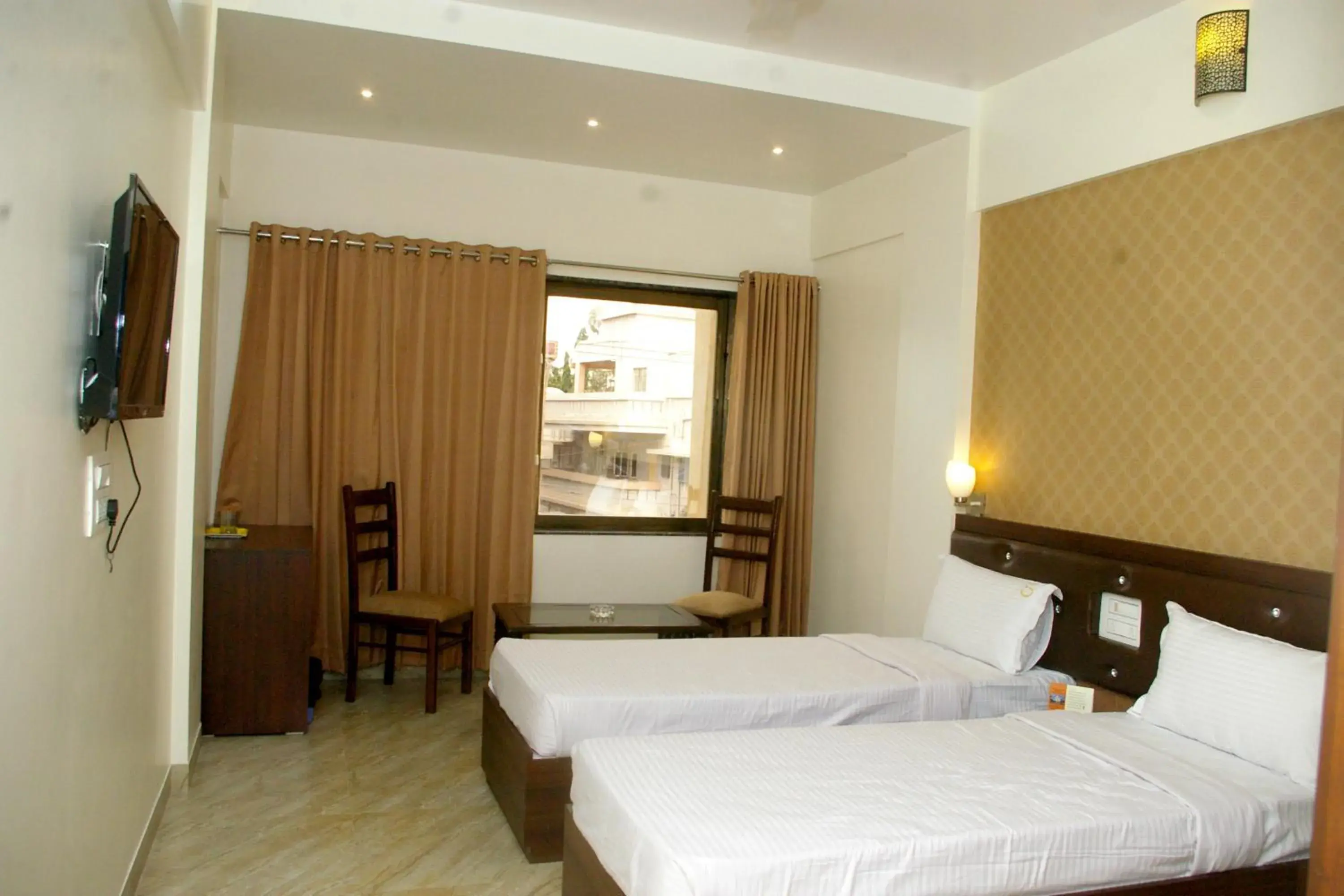 Photo of the whole room, Bed in Hotel Gulmohar Pride Photo of the whole room, Bed in Hotel Gulmohar Pride