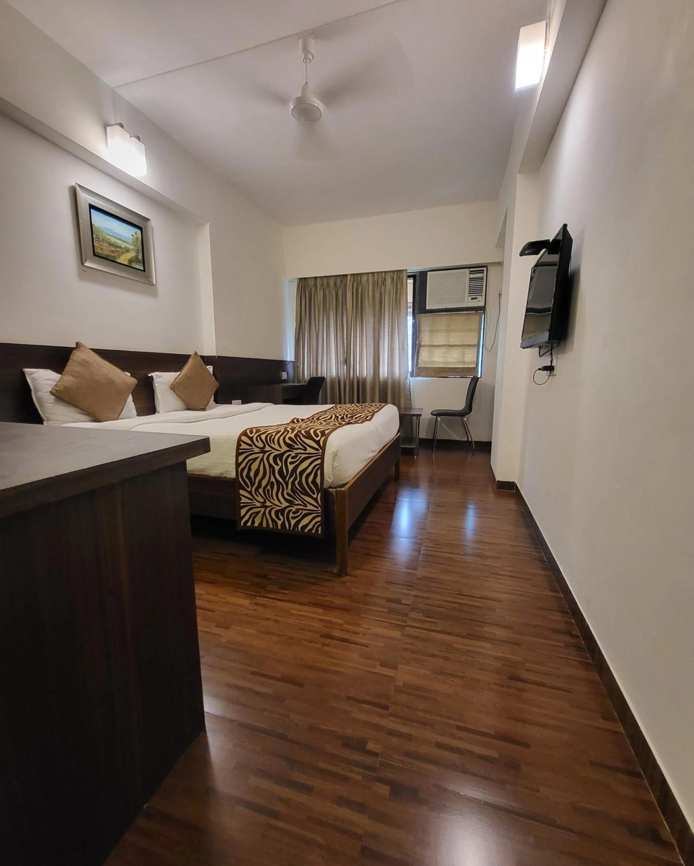 Photo of the whole room, Bed in Hotel Maharana Inn Chembur