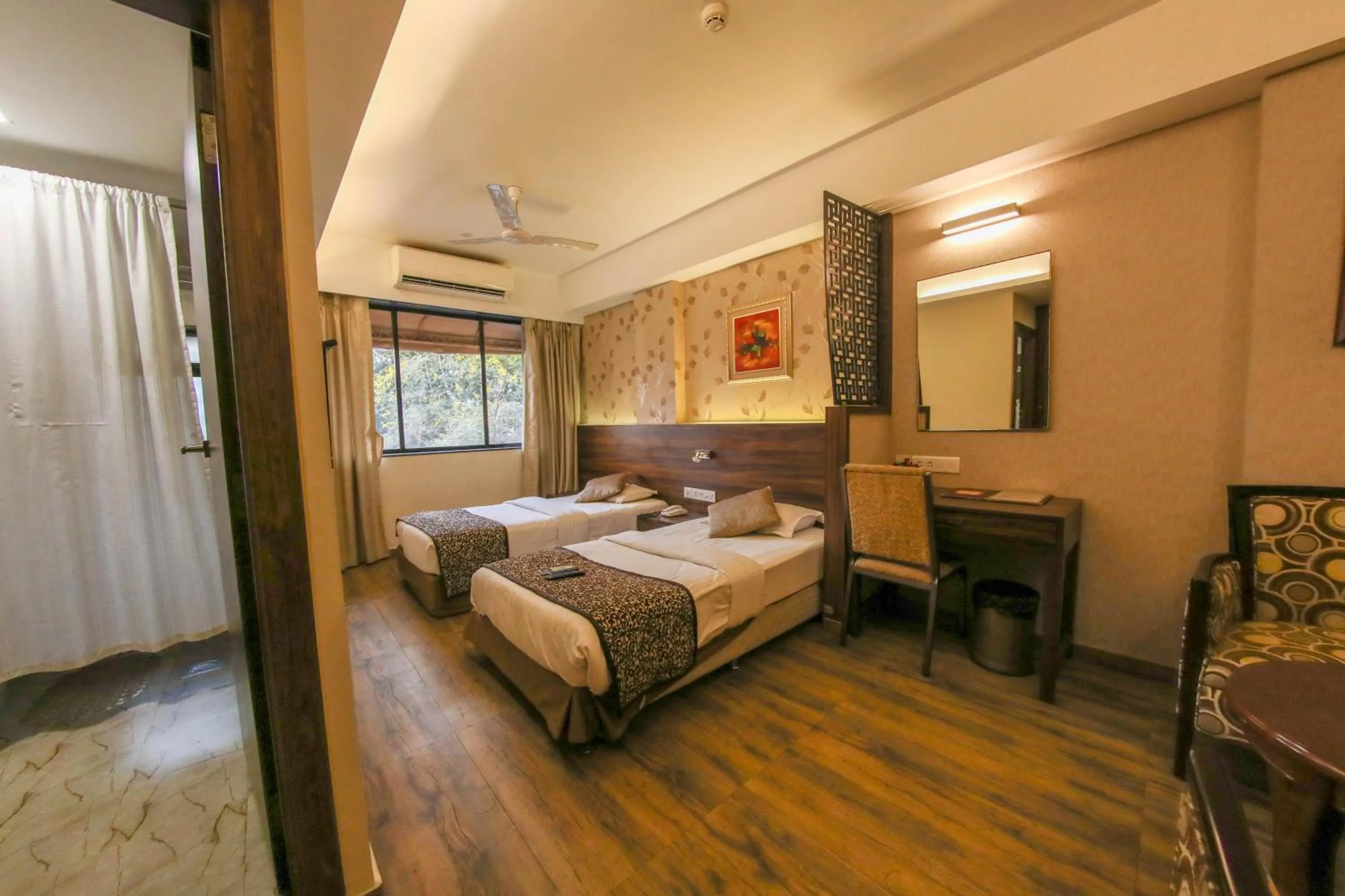 Photo of the whole room, Bed in Hotel Maharana Inn Chembur