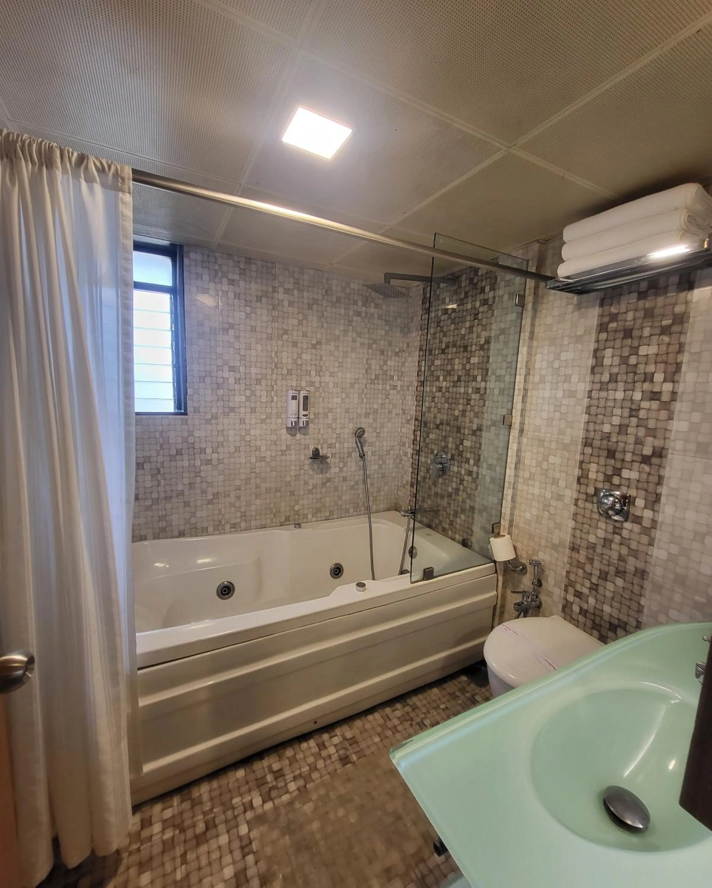 Bathroom in Hotel Maharana Inn Chembur