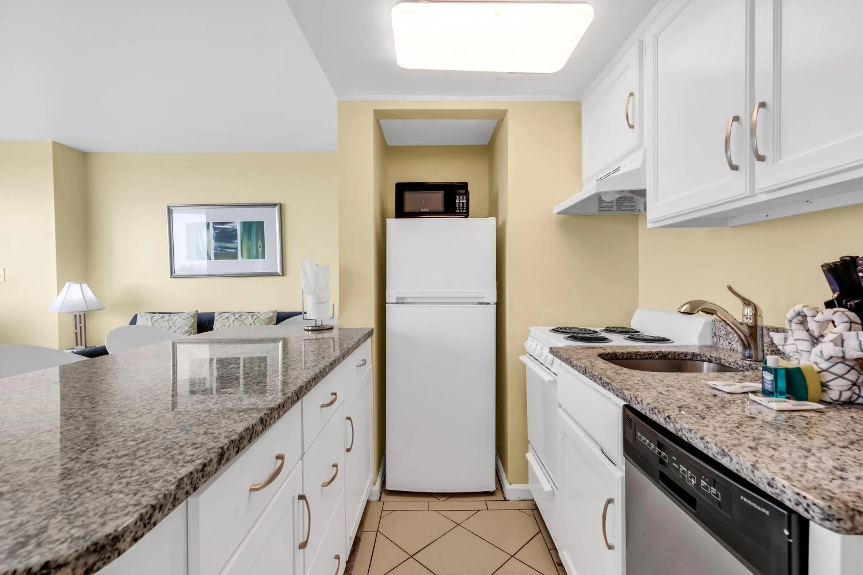 Kitchen or kitchenette in Oceanfront condo Steps to the beach w No Resort Fees