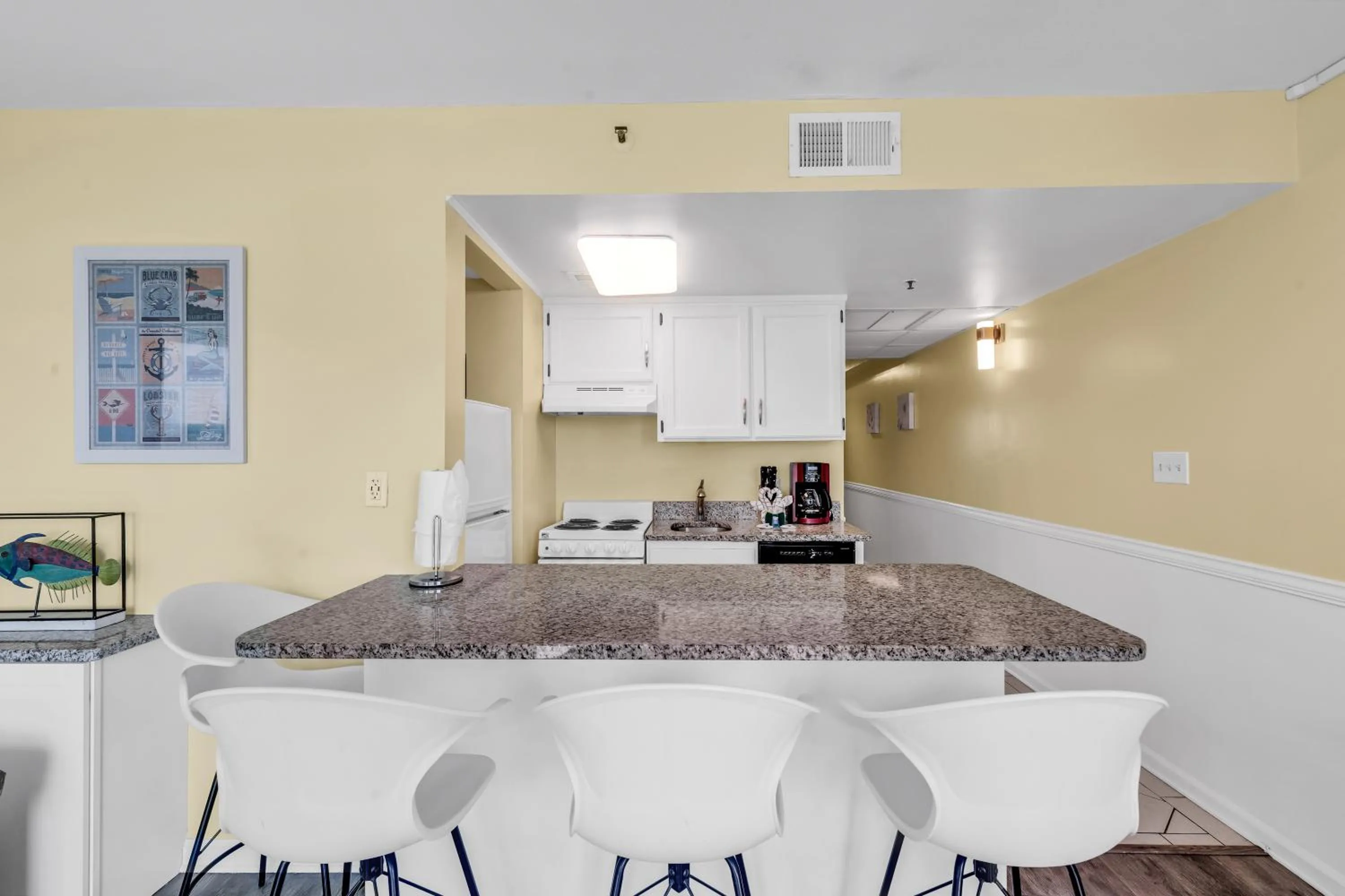 Kitchen or kitchenette in Oceanfront condo Steps to the beach w No Resort Fees