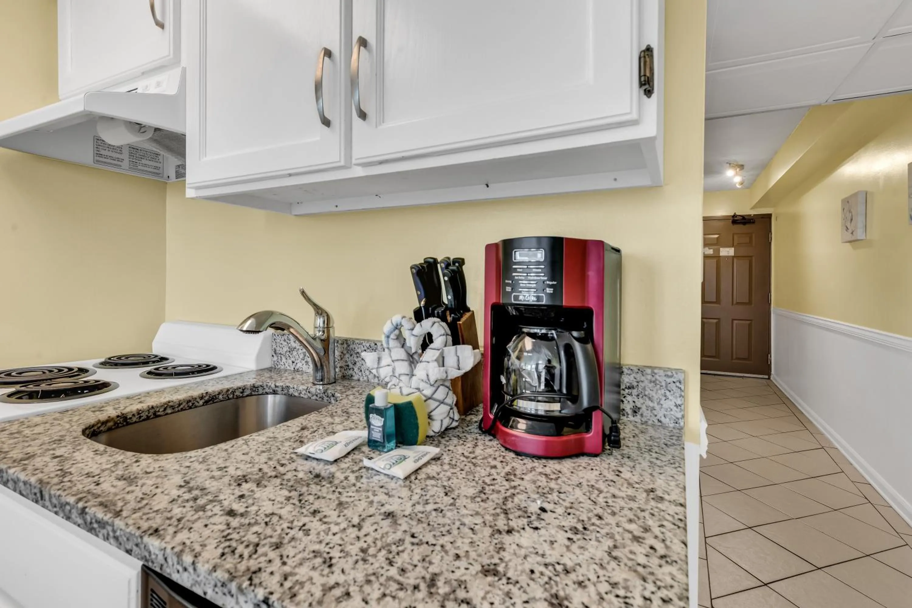 Kitchen or kitchenette in Oceanfront condo Steps to the beach w No Resort Fees