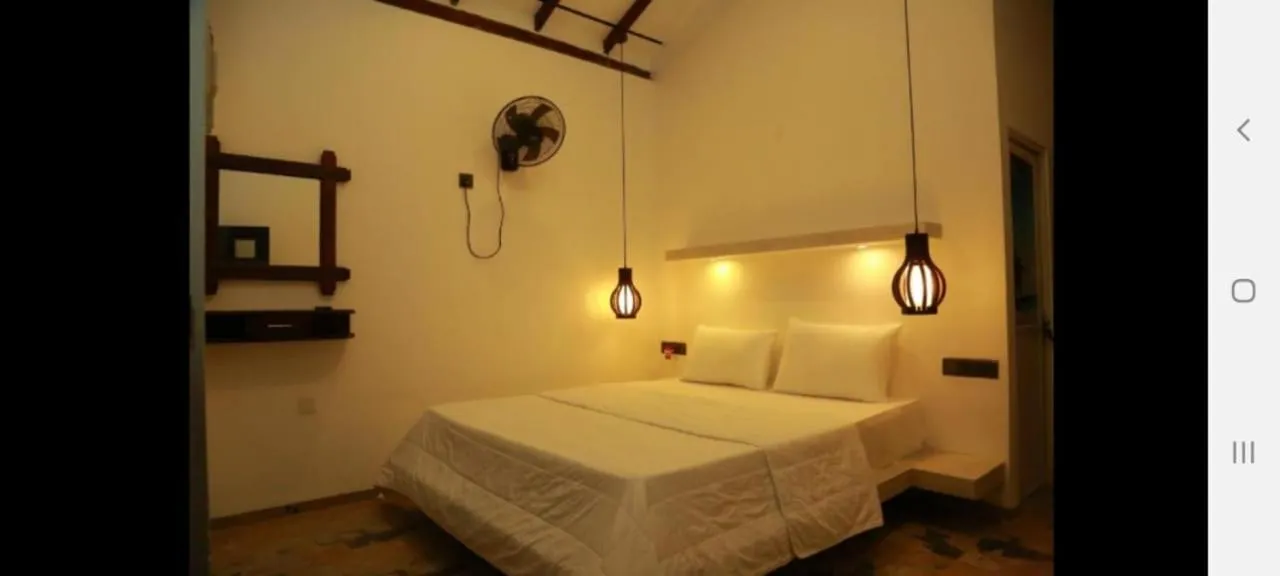 Bed in Midigama Holiday Inn