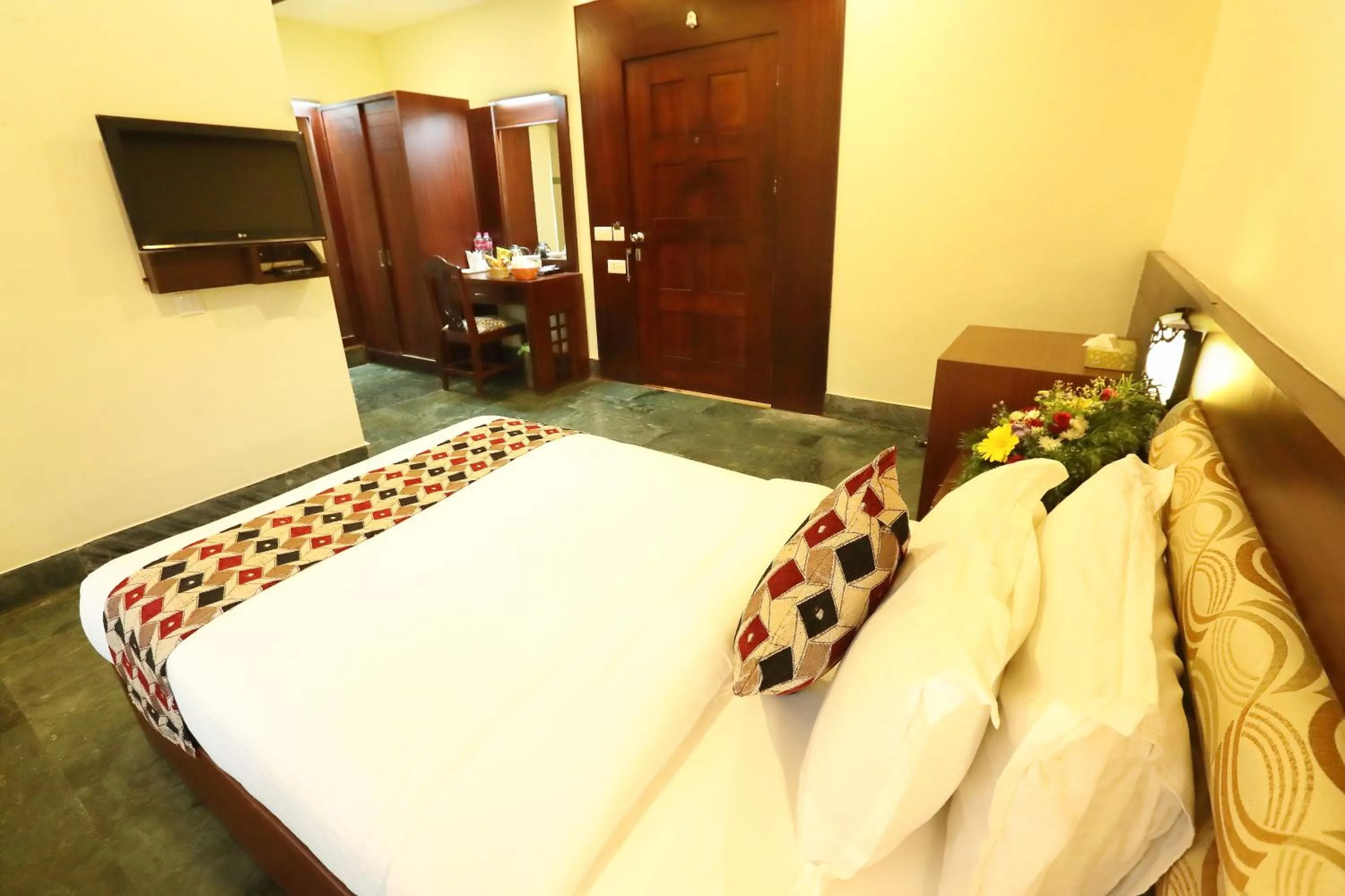 Bed in Hotel Indraprastha varkala