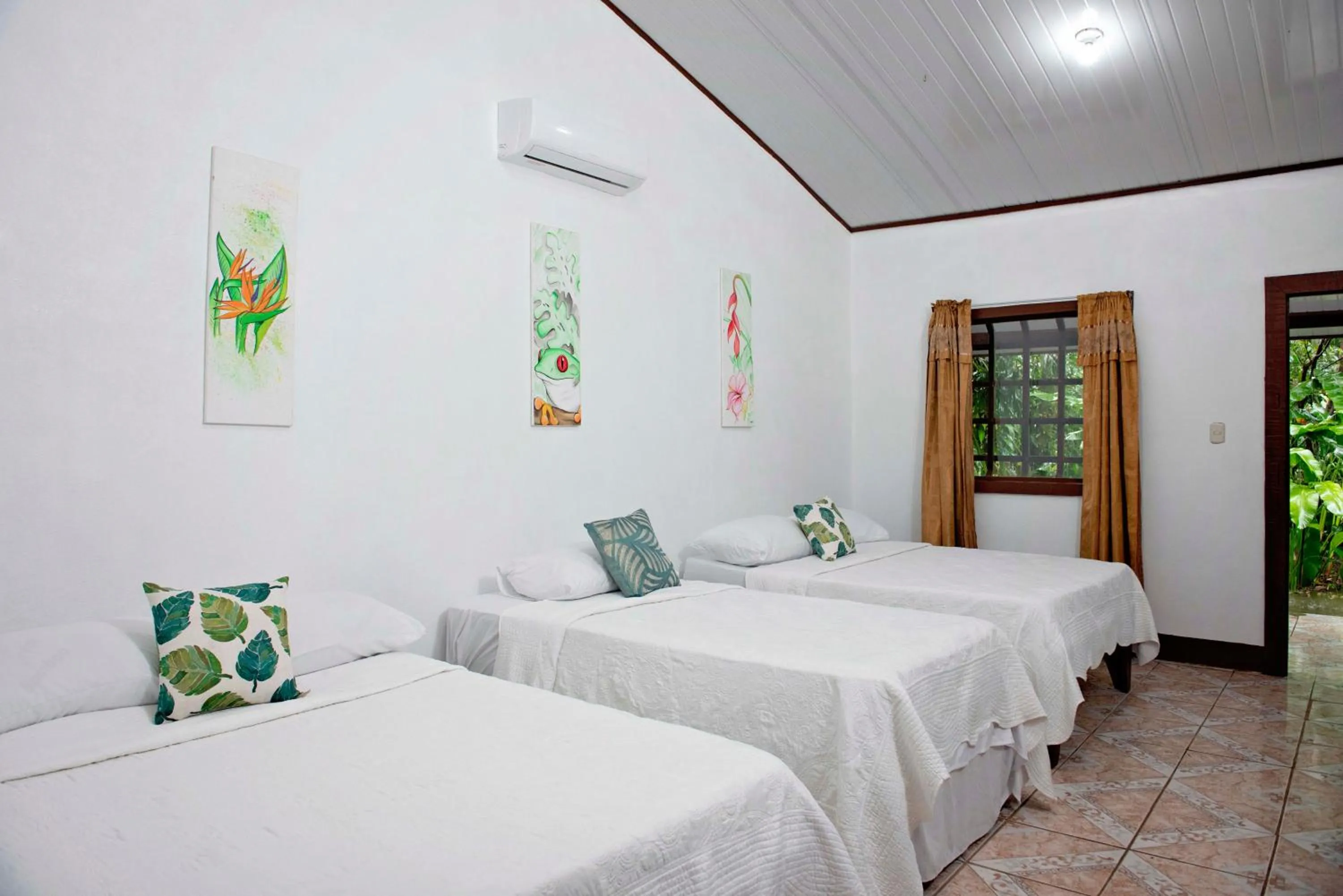 Bed in Hotel Tortuguero Beachfront