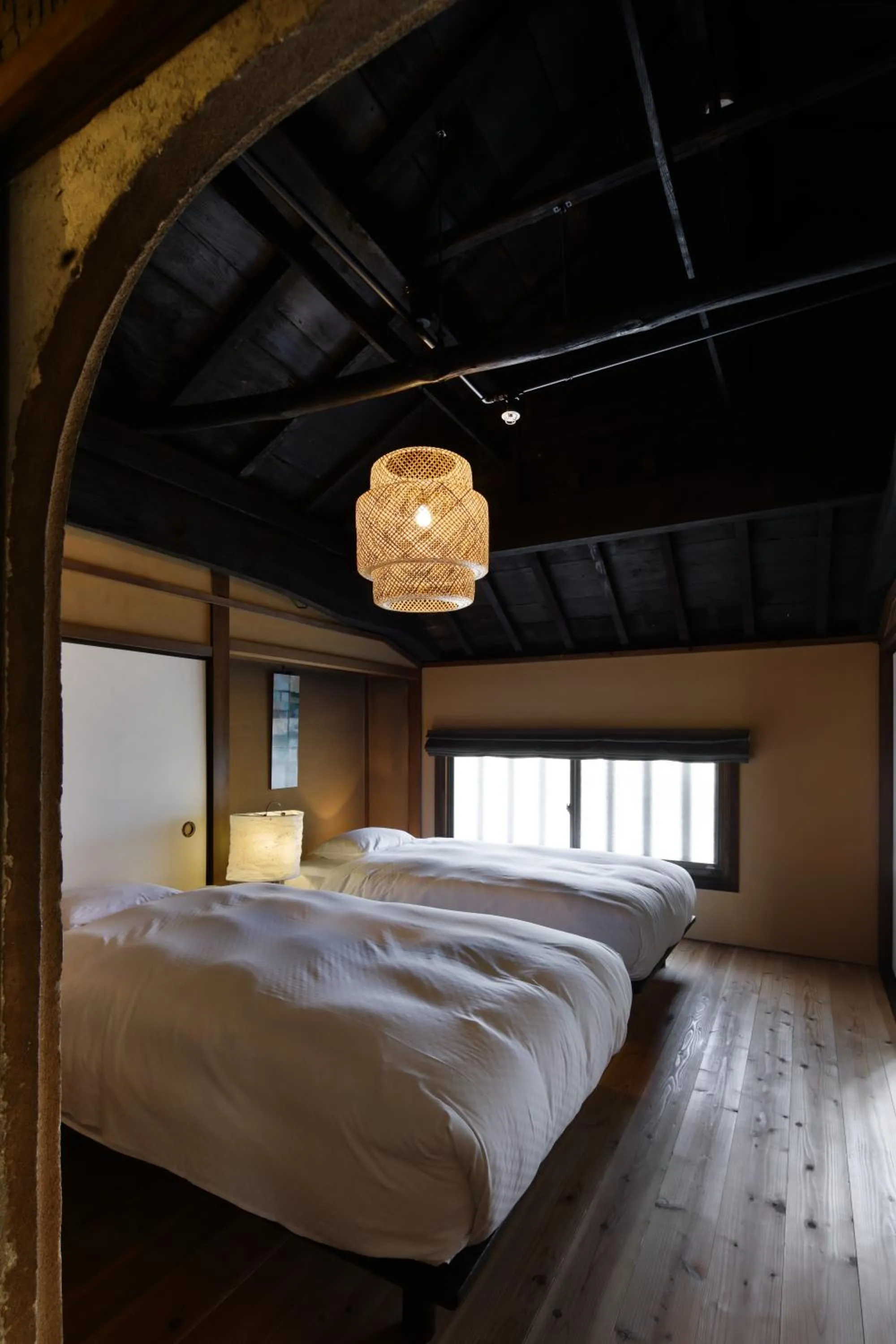 Bed in NIPPONIA Sasayama Castle Town Hotel