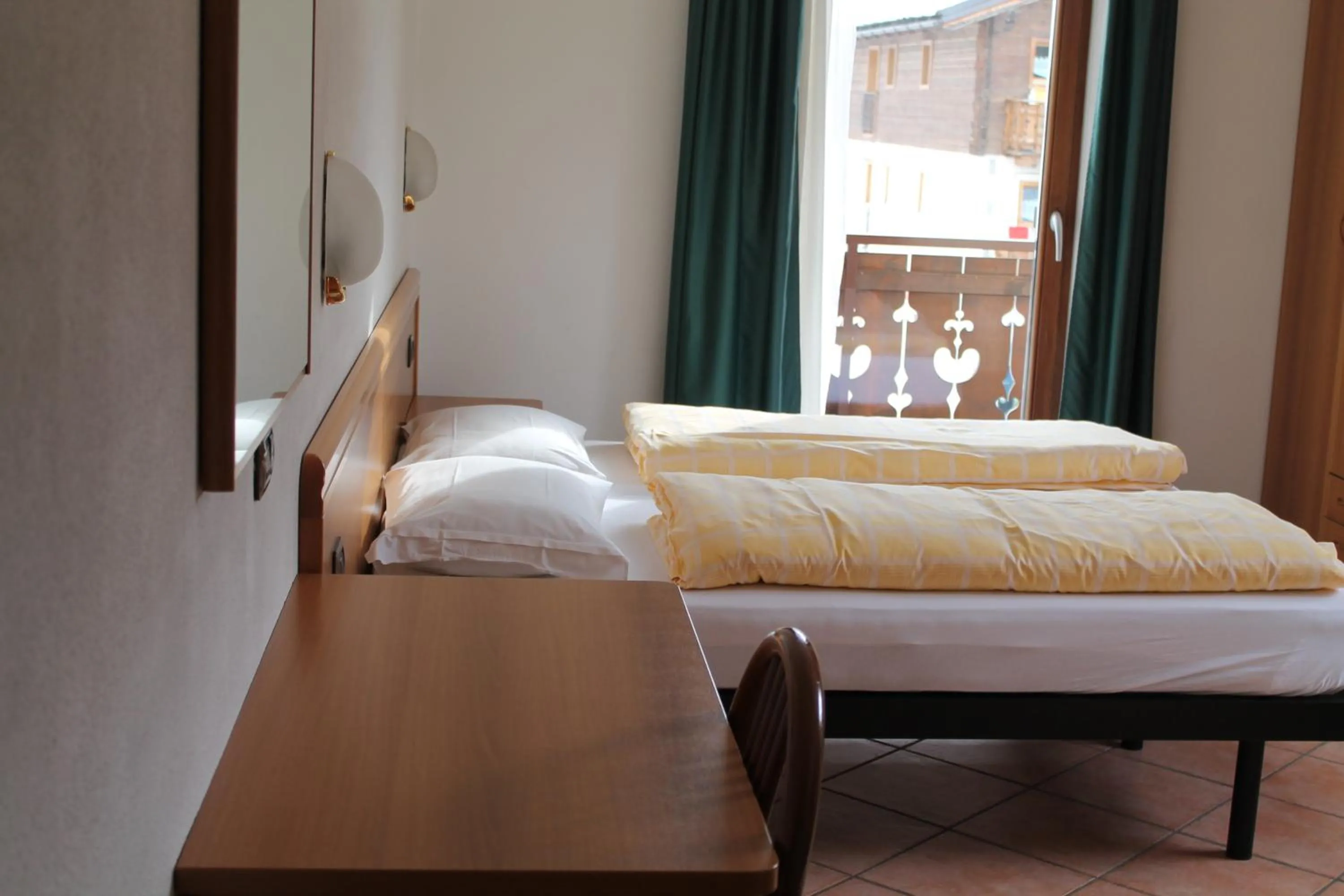 Bedroom in Hotel Miramonti