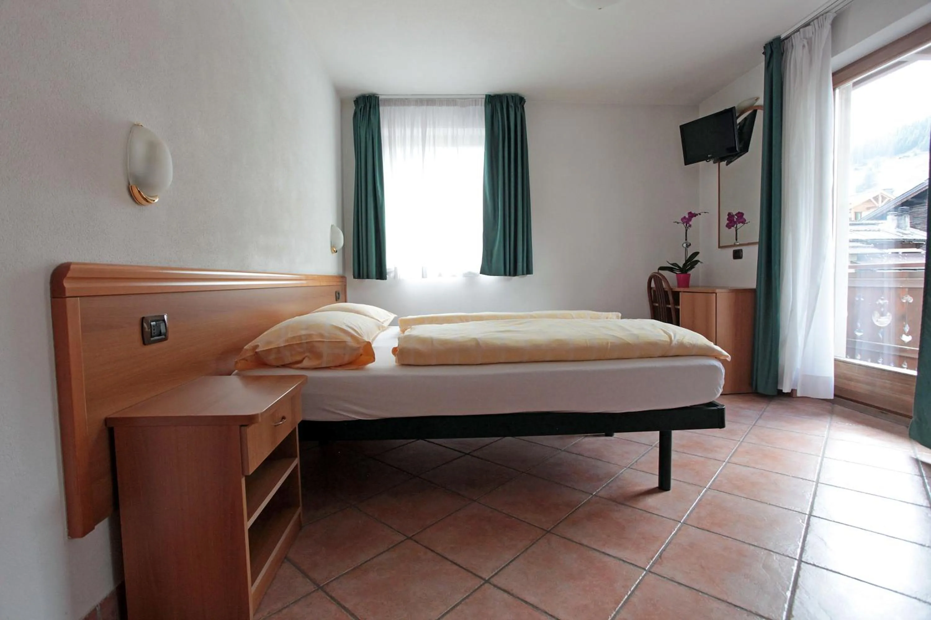 Bedroom in Hotel Miramonti