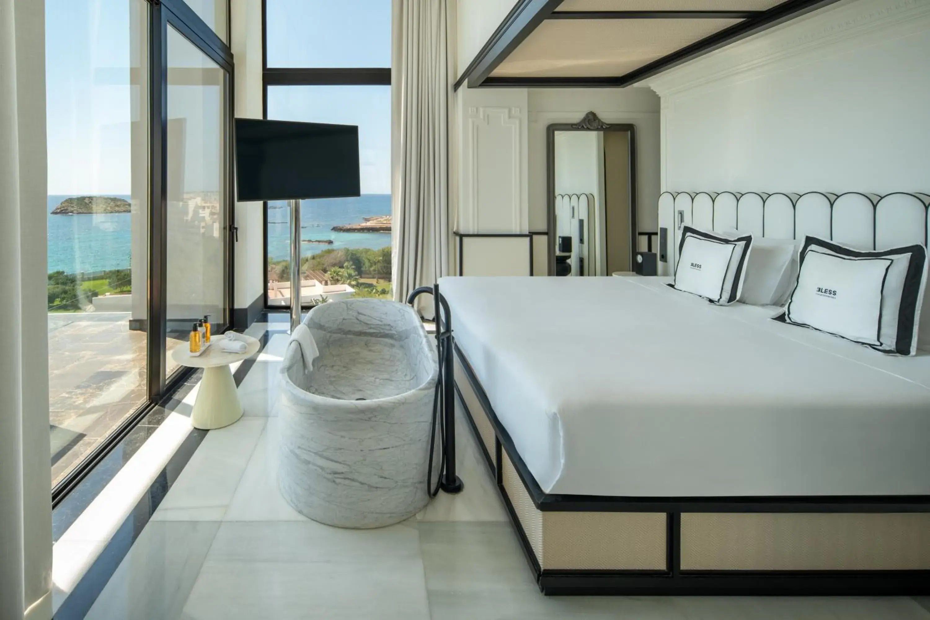 Communal lounge/ TV room, Bed in BLESS Hotel Ibiza - The Leading Hotels of The World Communal lounge/ TV room, Bed in BLESS Hotel Ibiza - The Leading Hotels of The World