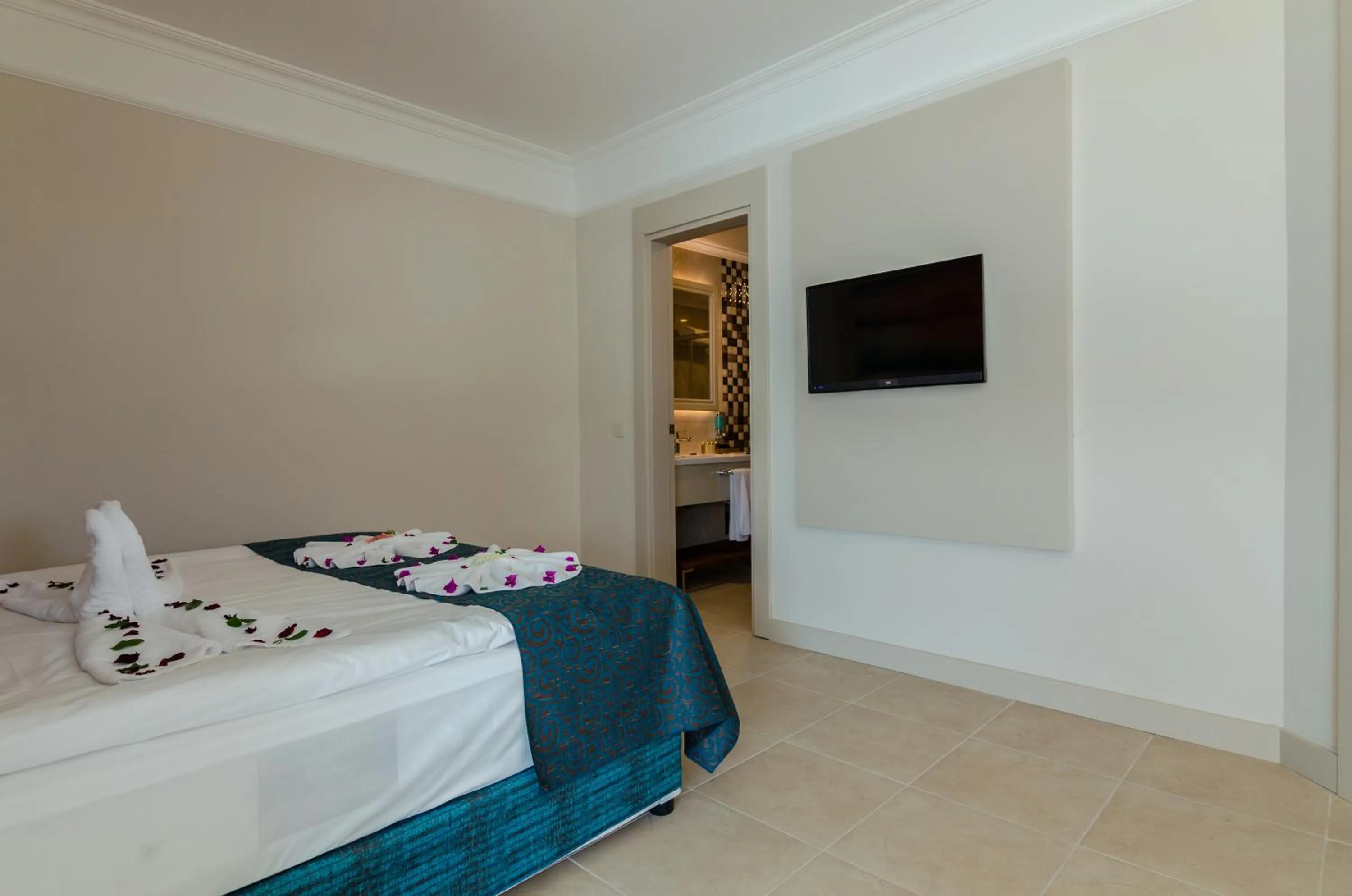 Bed in The Lumos Deluxe Resort Hotel & Spa