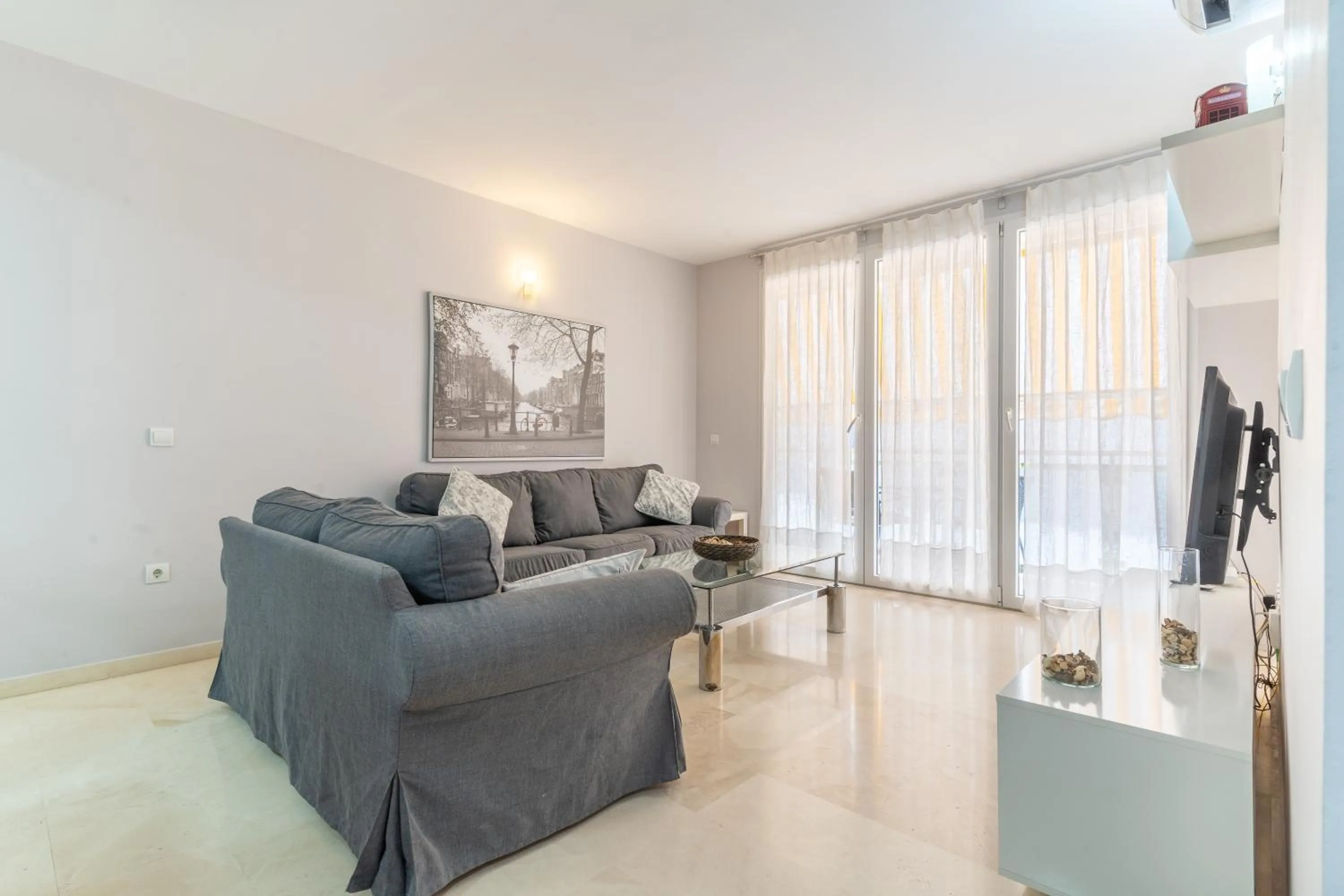 Living room in Apartamentos Castillo by Sur Suites