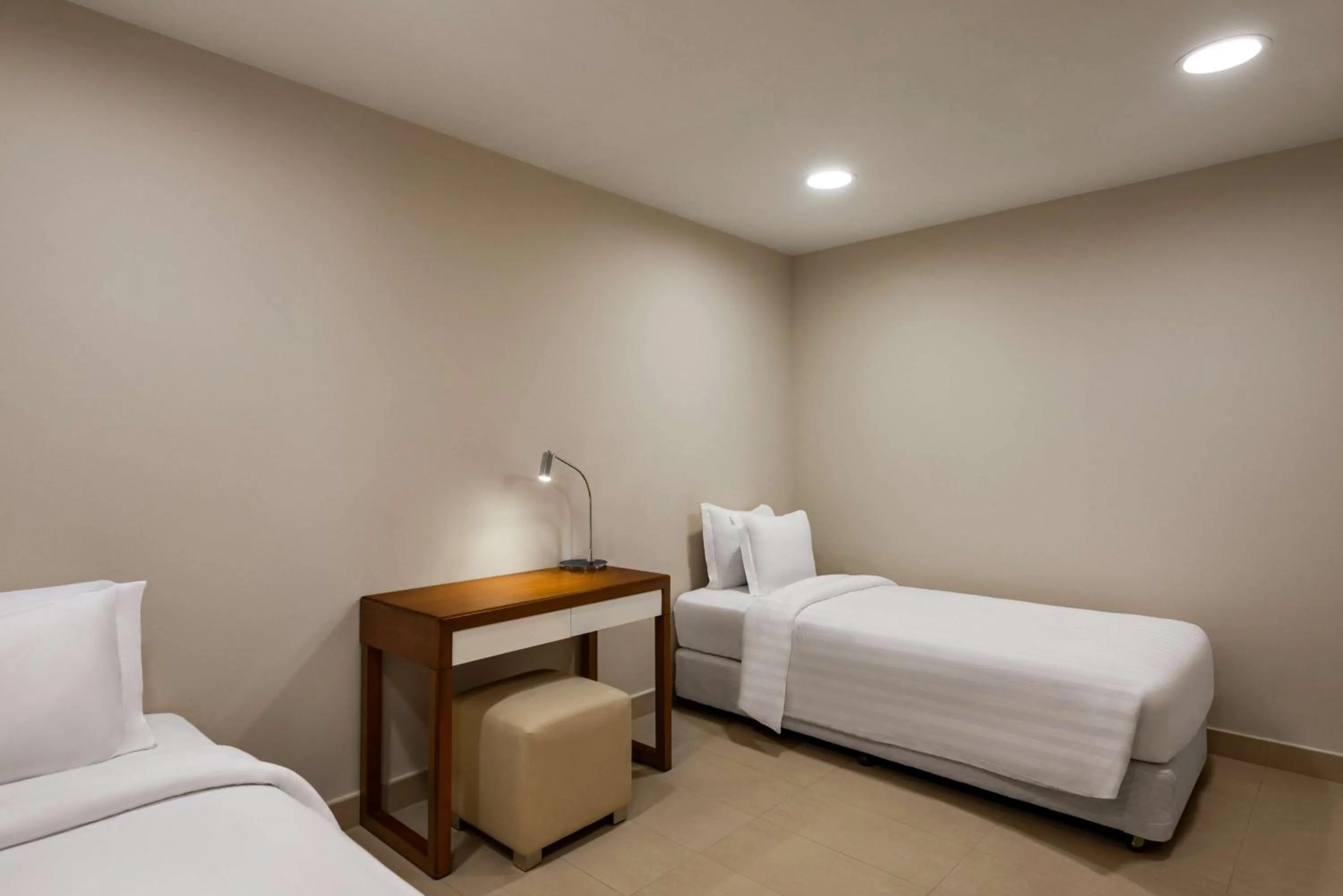 Bed in Levatio Suites Muscat, a member of Radisson Individuals