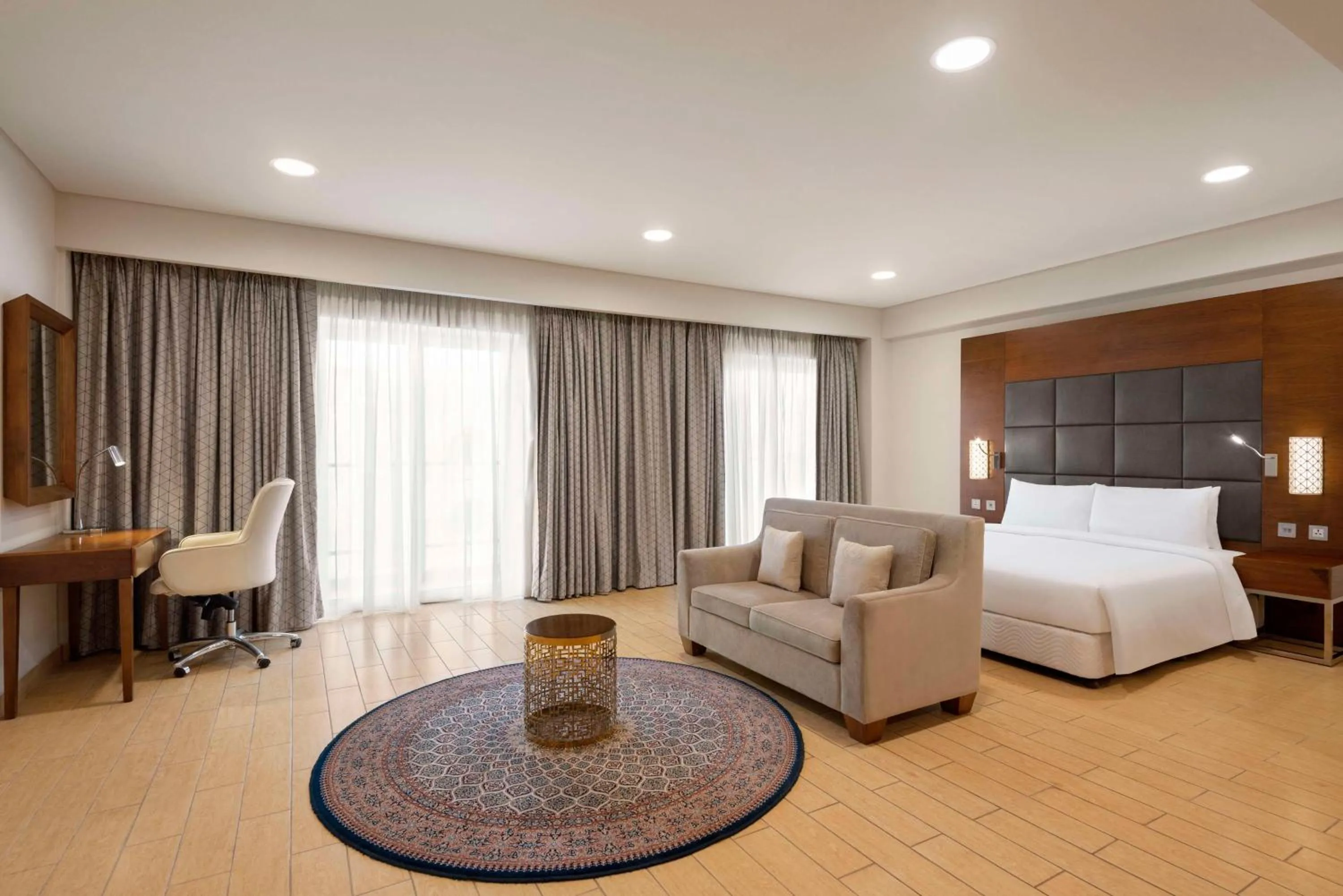 Photo of the whole room, Bed in Levatio Suites Muscat, a member of Radisson Individuals