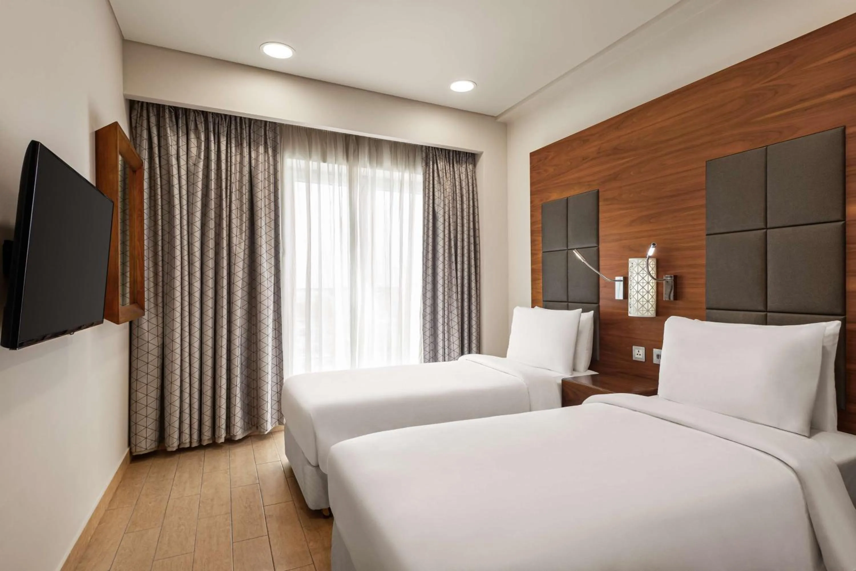 Photo of the whole room, Bed in Levatio Suites Muscat, a member of Radisson Individuals