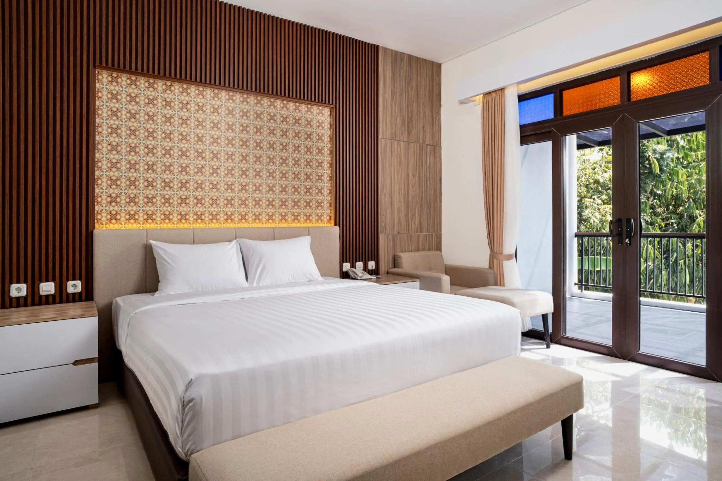 Photo of the whole room, Bed in The Amrta Borobudur