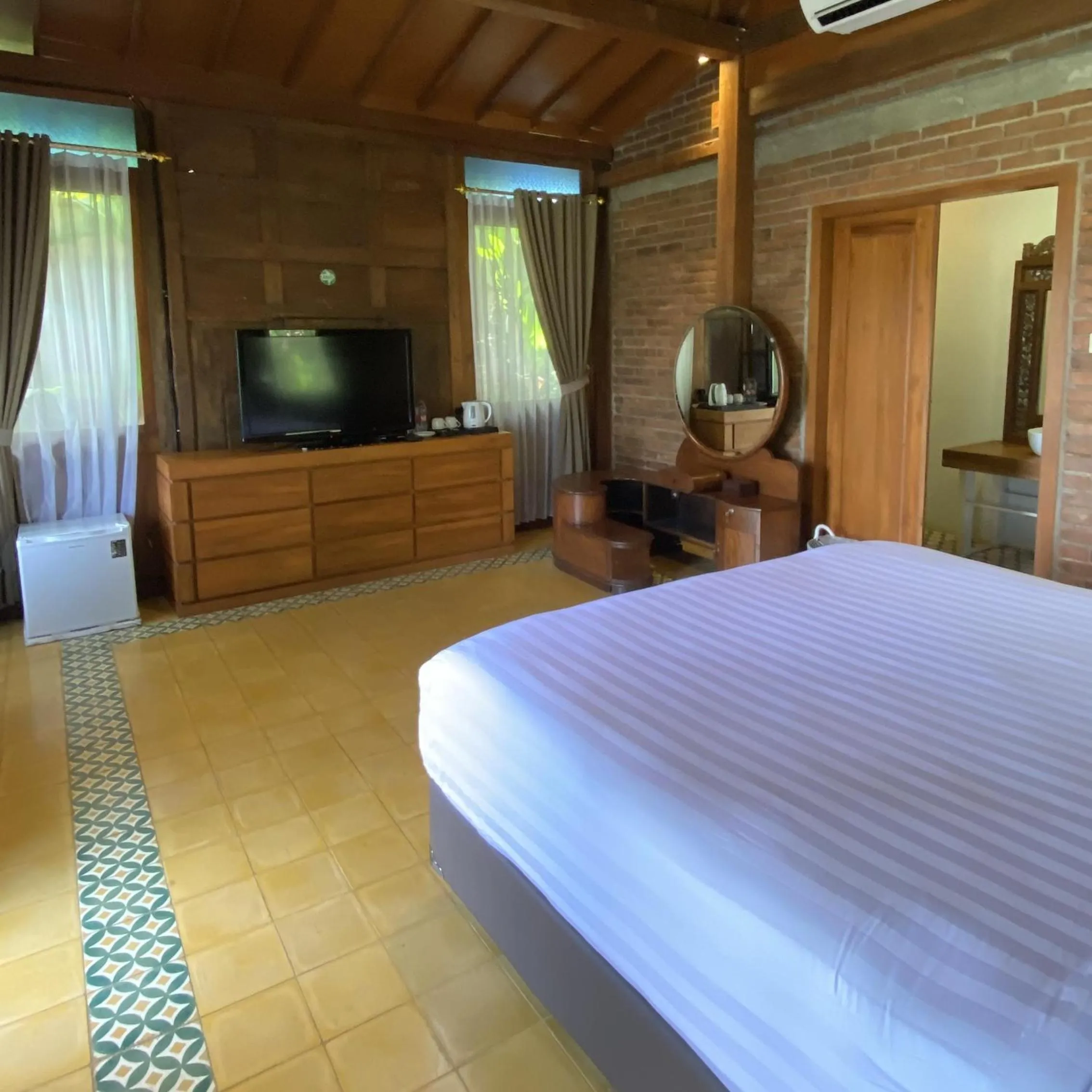 Bed in The Amrta Borobudur