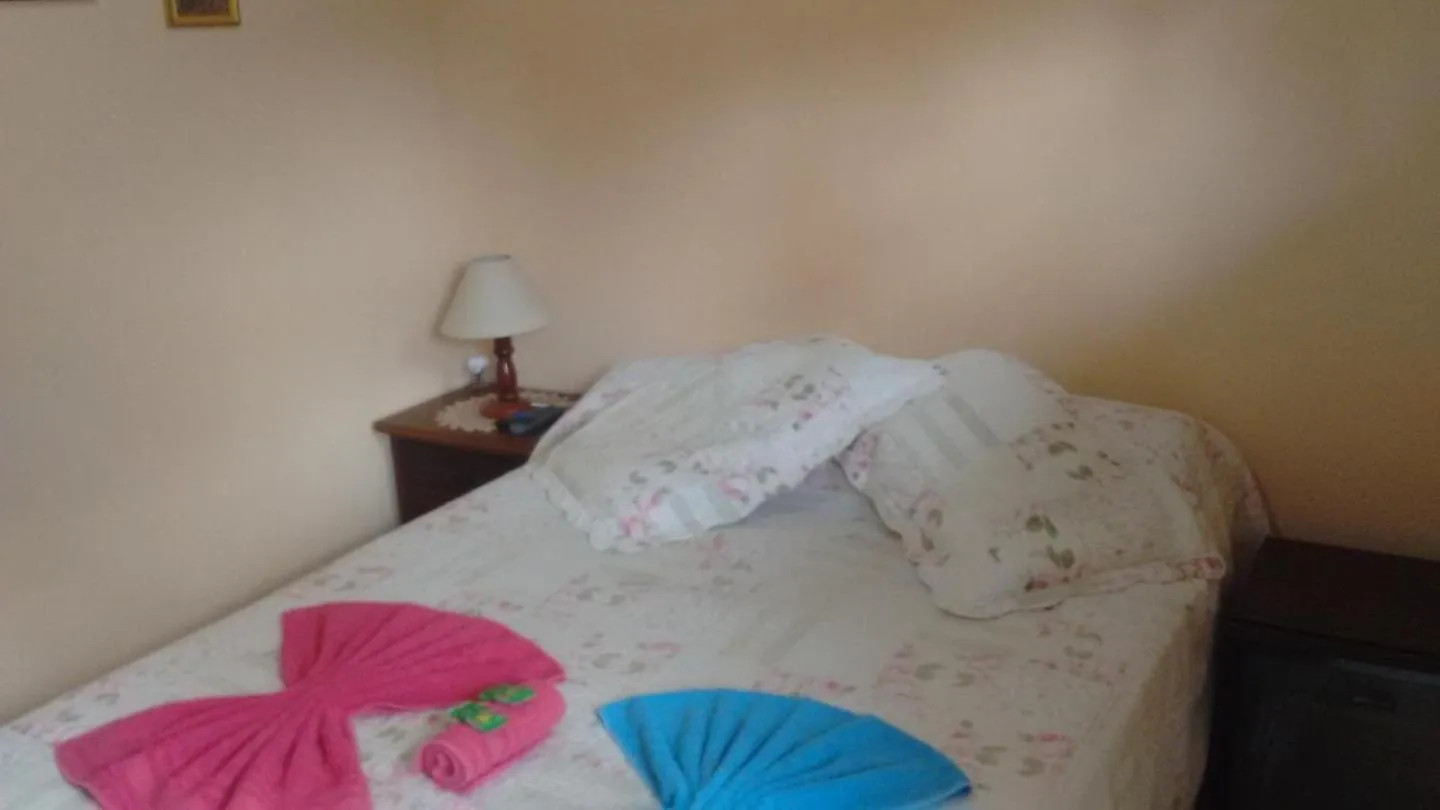Bed in Sítio e Pousada Recanto Dos Ipês