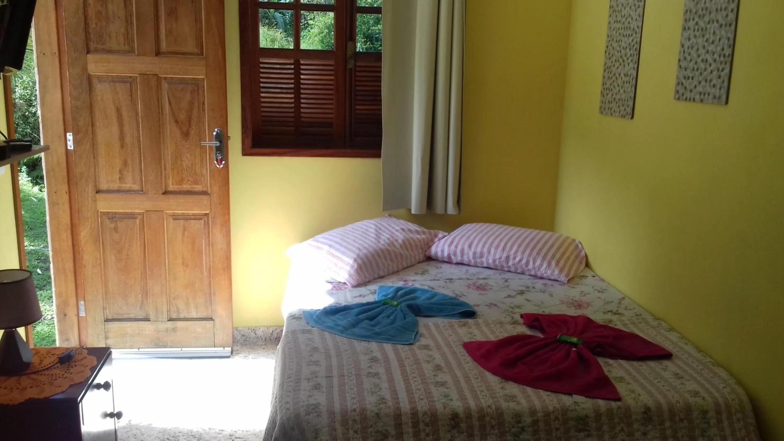 Bed in Sítio e Pousada Recanto Dos Ipês