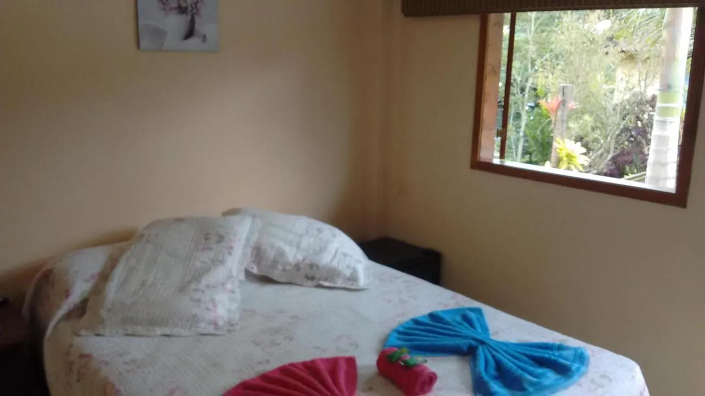 Bed in Sítio e Pousada Recanto Dos Ipês