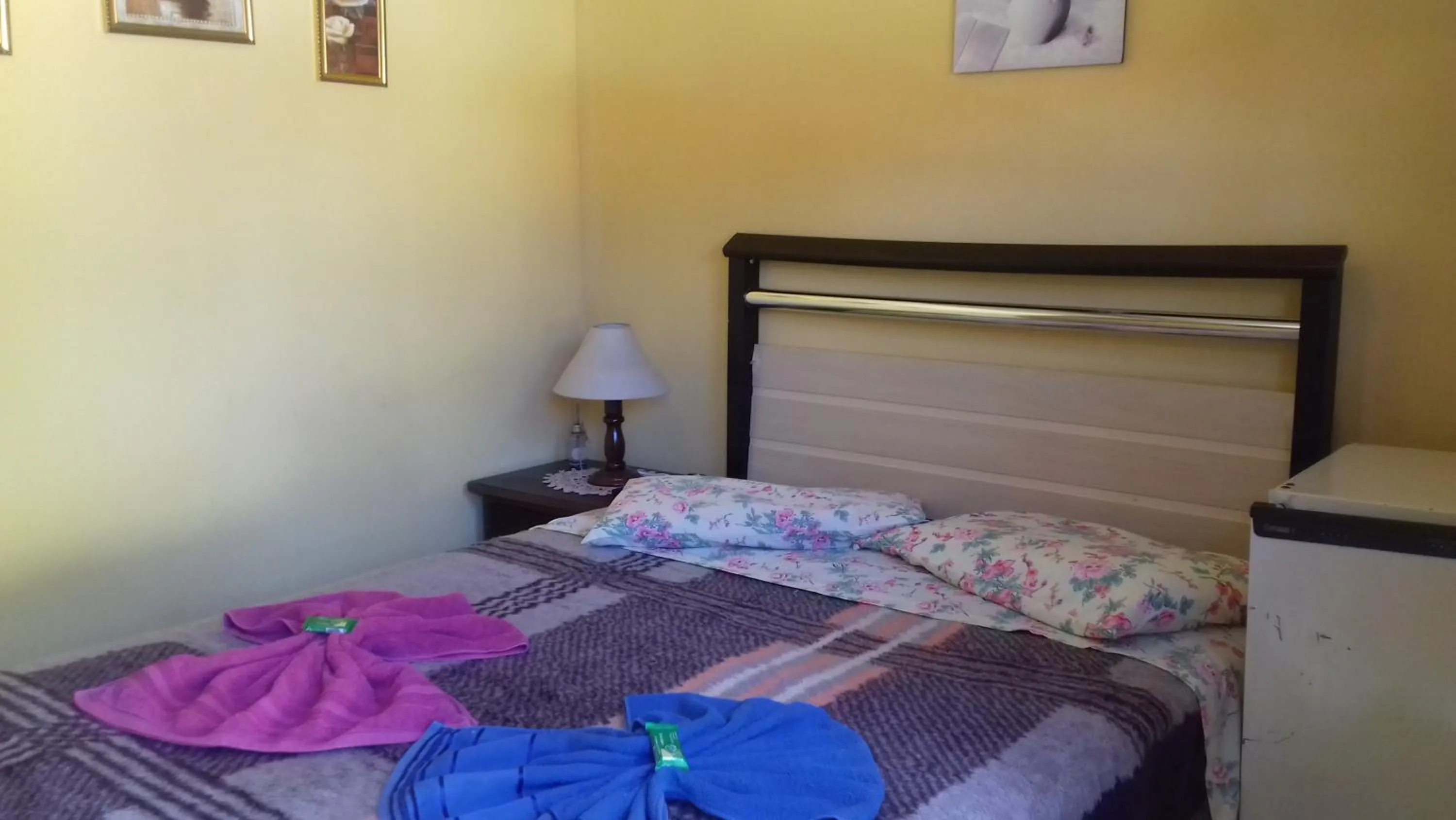 Bed in Sítio e Pousada Recanto Dos Ipês