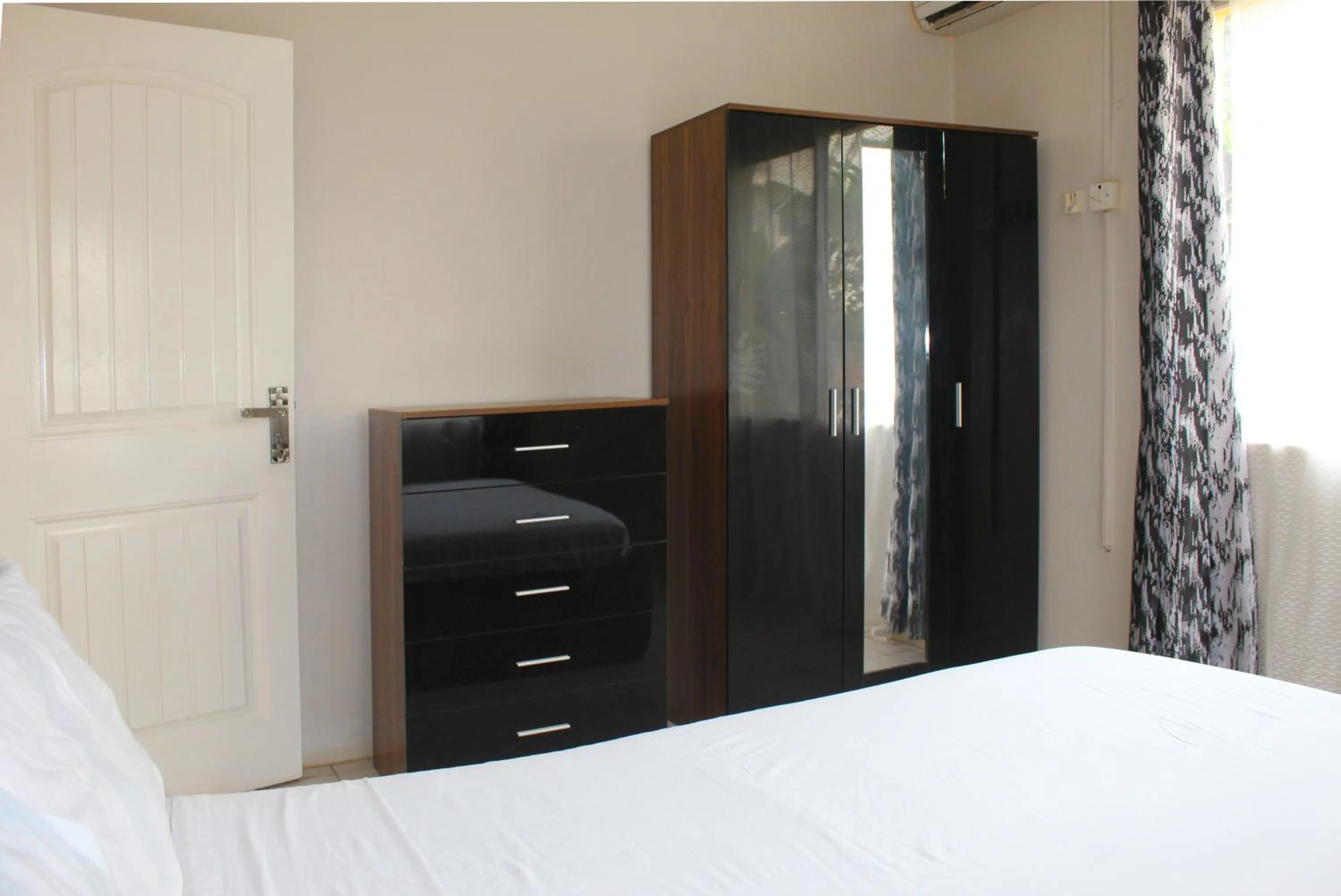 wardrobe, Bed in Harmony house apartments